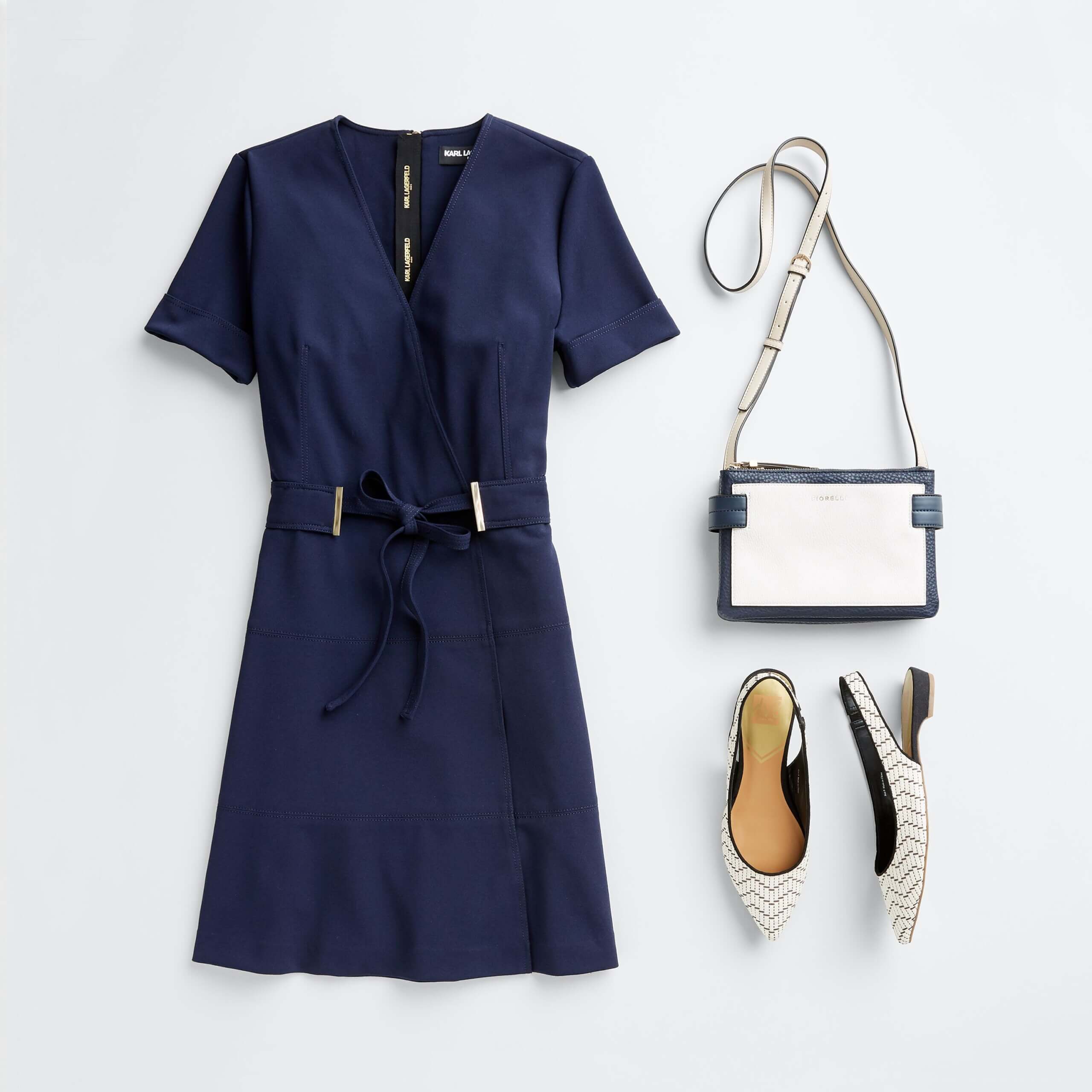 Stitch Fix Women's outfit laydown featuring navy tie-waist dress, white slingback flats and white crossbody purse. 