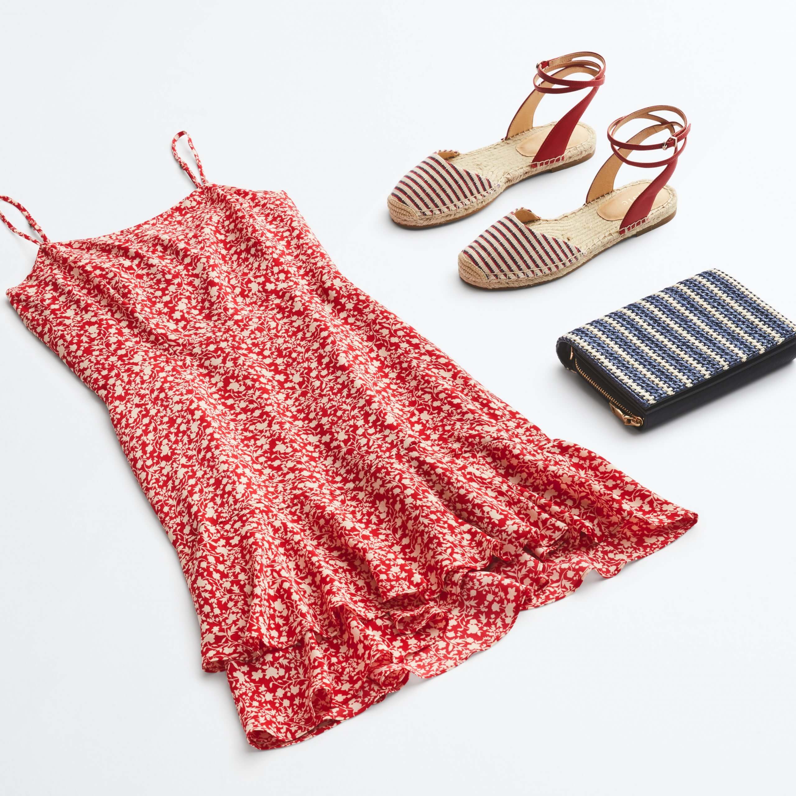 Stitch Fix women’s 4th of July outfit laydown featuring red and white printed dress, blue and white striped clutch and red and white striped espadrille flats.