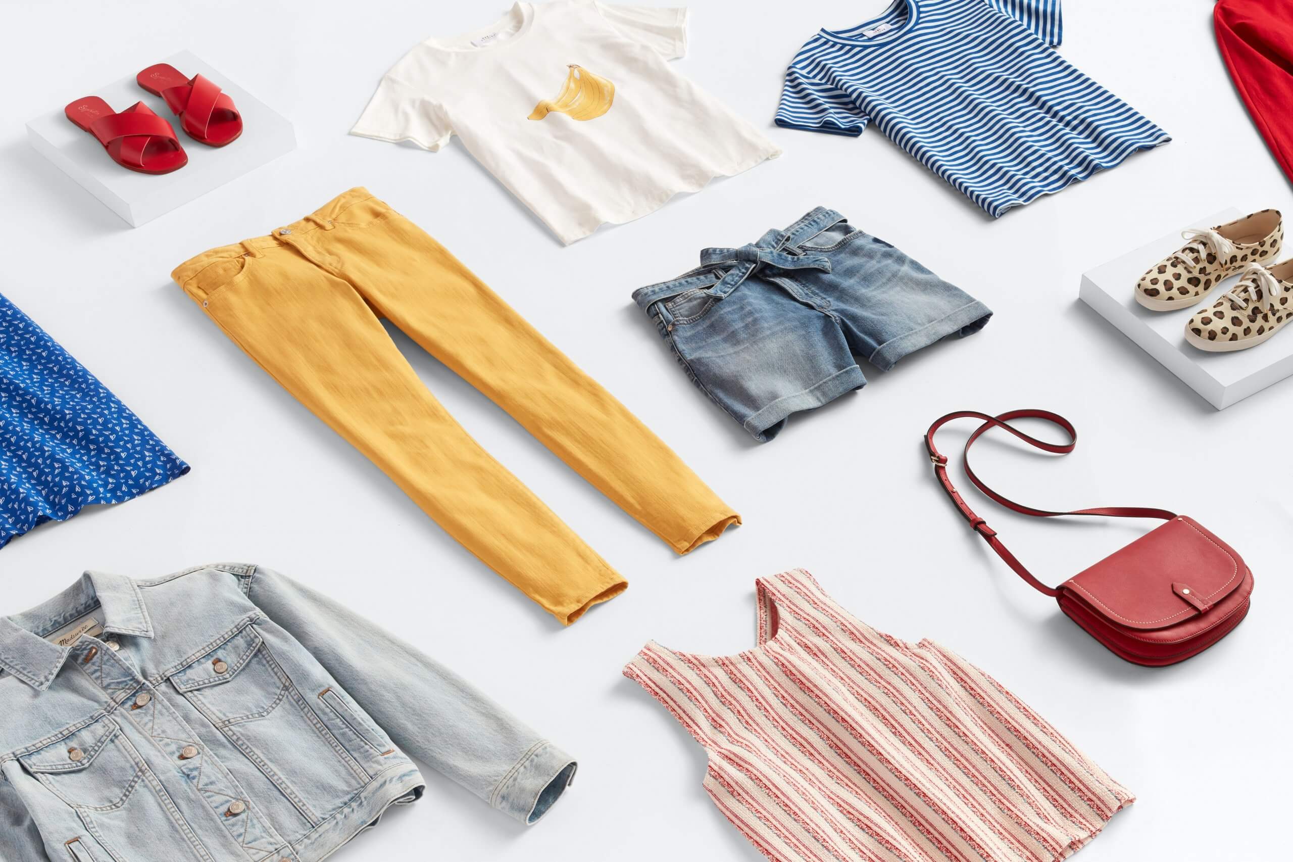 Stitch Fix women’s outfit laydown featuring blue, red, yellow and white clothing and accessories. 