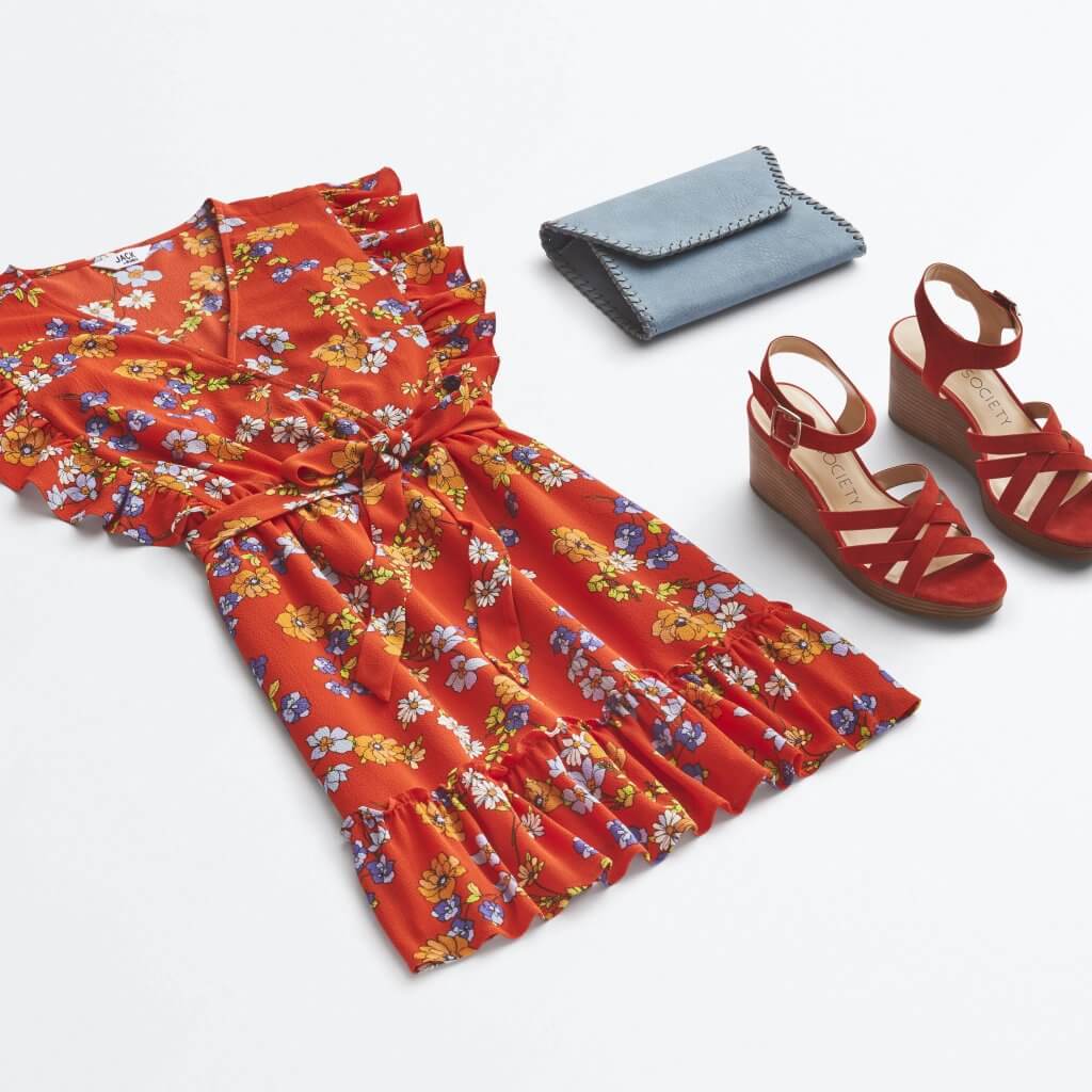 Stitch Fix women’s boho outfit featuring red floral-print dress, blue woven clutch and red wedges.