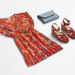 Stitch Fix women’s boho outfit featuring red floral-print dress, blue woven clutch and red wedges.
