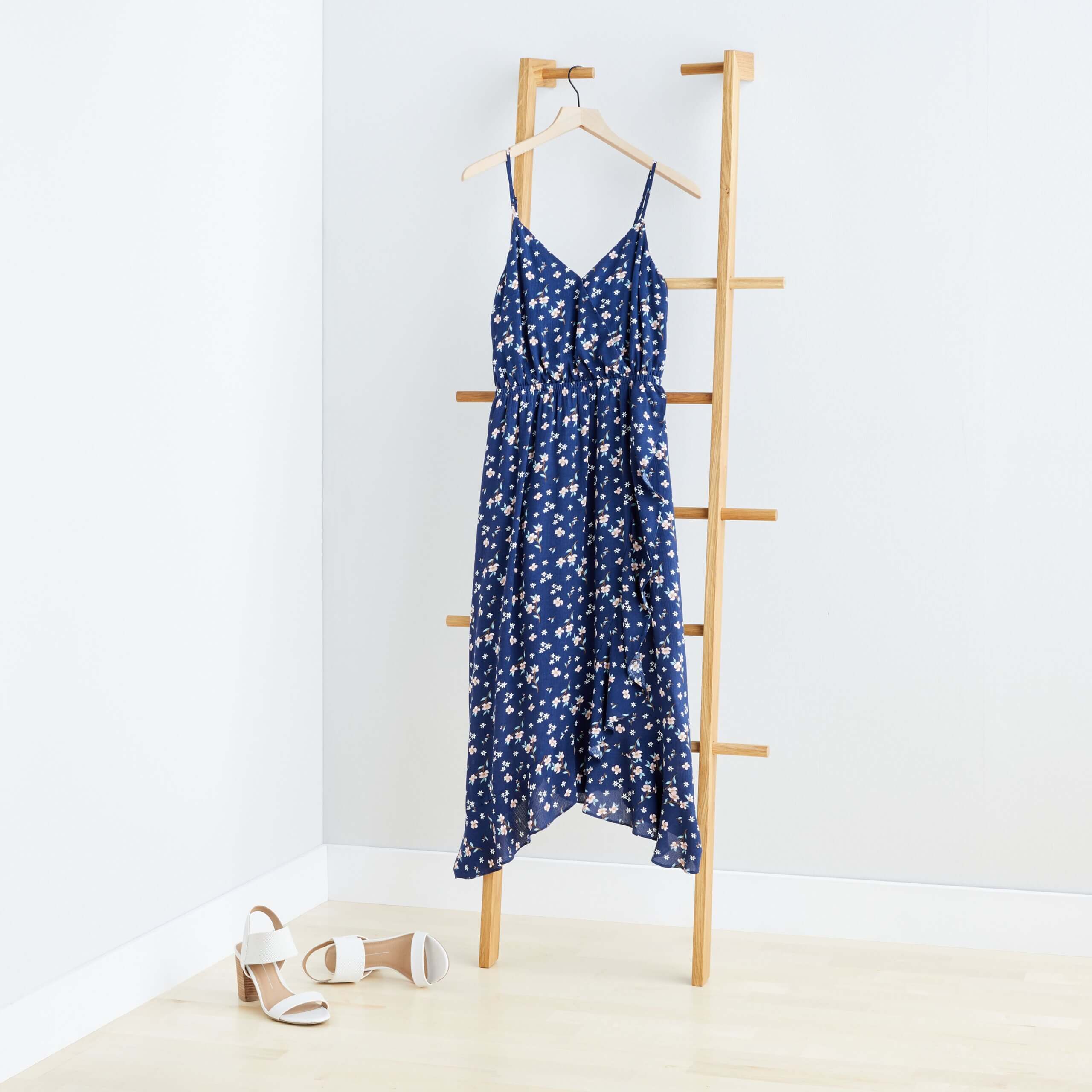 Stitch Fix navy floral maxi dress hanging on ladder with white strappy heels.