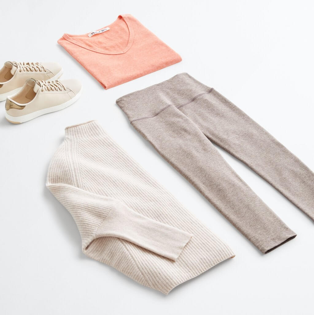 Stitch Fix women’s apple-picking outfit with tan leggings, peach scoop neck T-shirt, off-white mock turtleneck sweater and off-white lace-up sneakers.