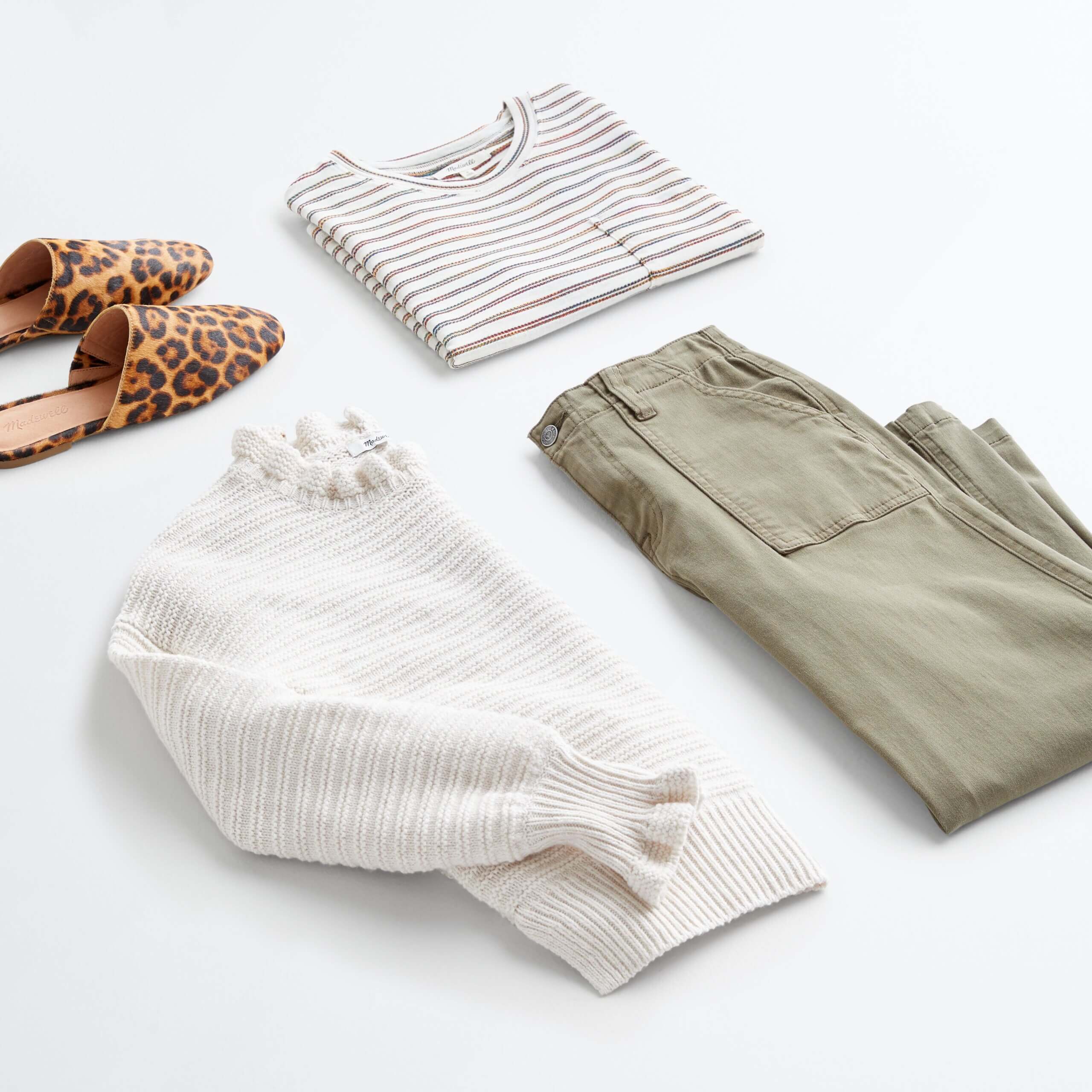 Stitch Fix Women's outfit laydown featuring olive utility pants, beige pullover sweater, striped tee and animal-print slide-on flats.