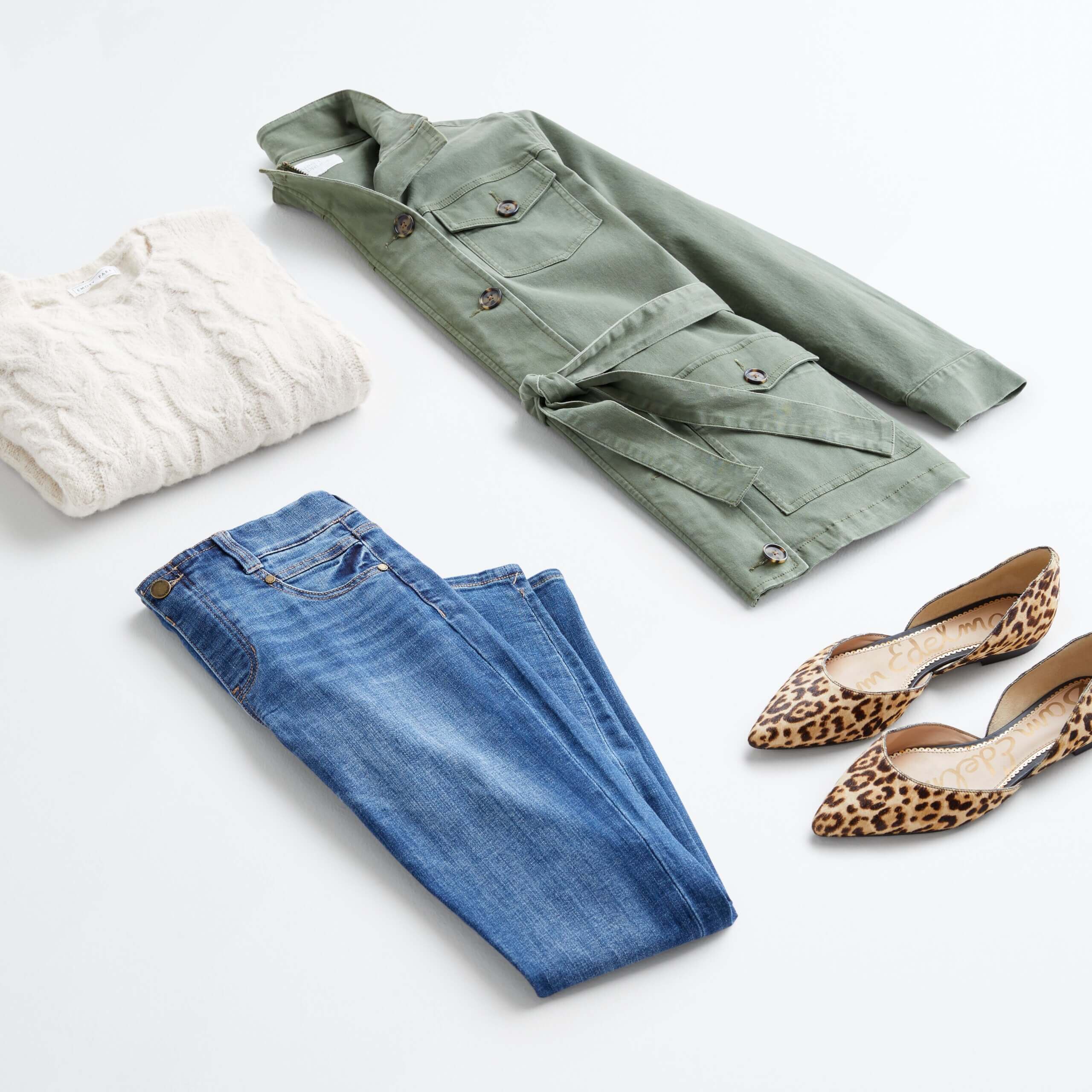 Stitch Fix Women's outfit laydown featuring cream cable knit pullover, green cargo jacket, blue jeans and cheetah print flats. 