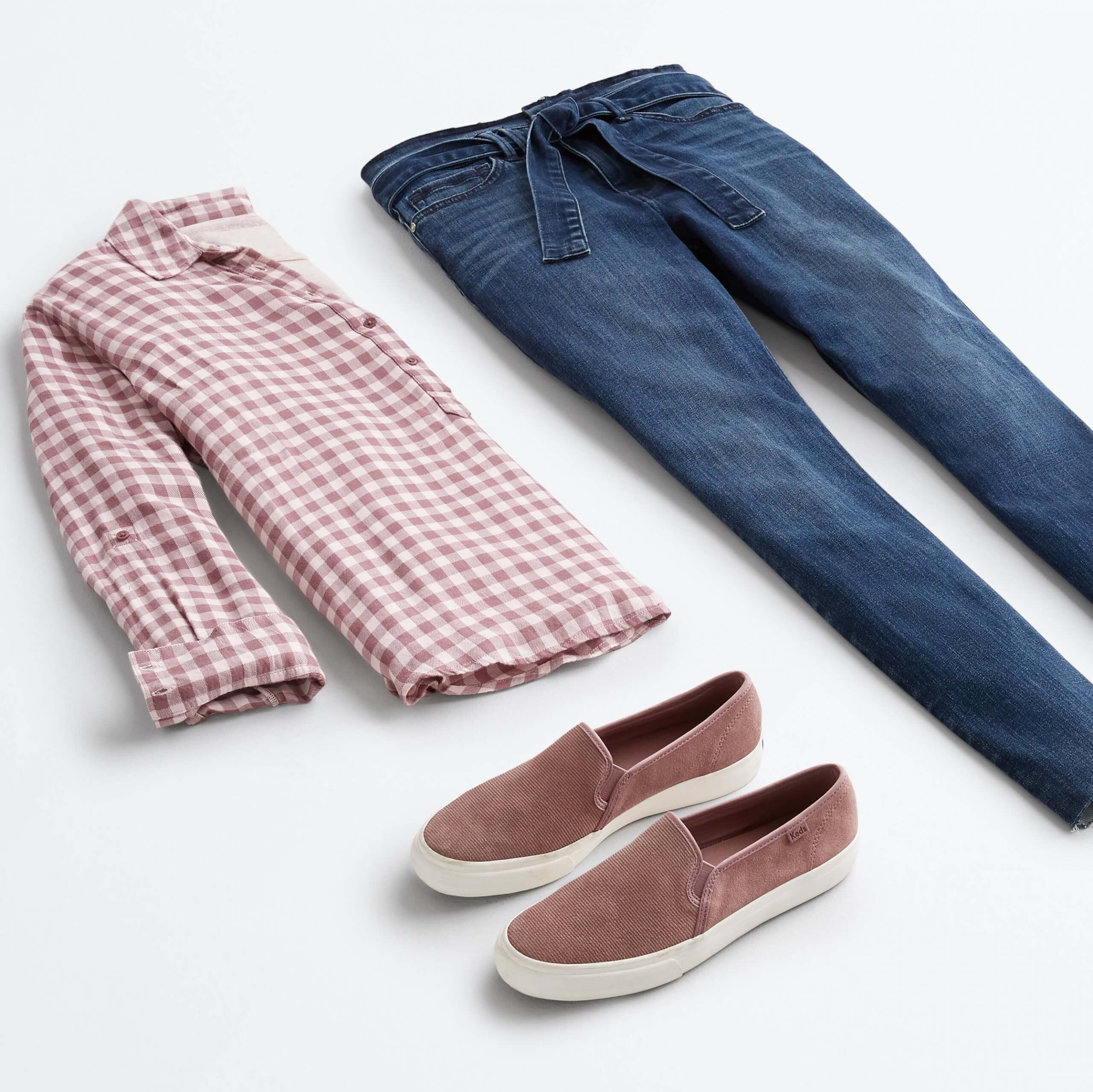 Stitch Fix outfit laydown featuring a gingham button-down shirt, tie-waist skinny jeans and mauve slip-on sneakers.