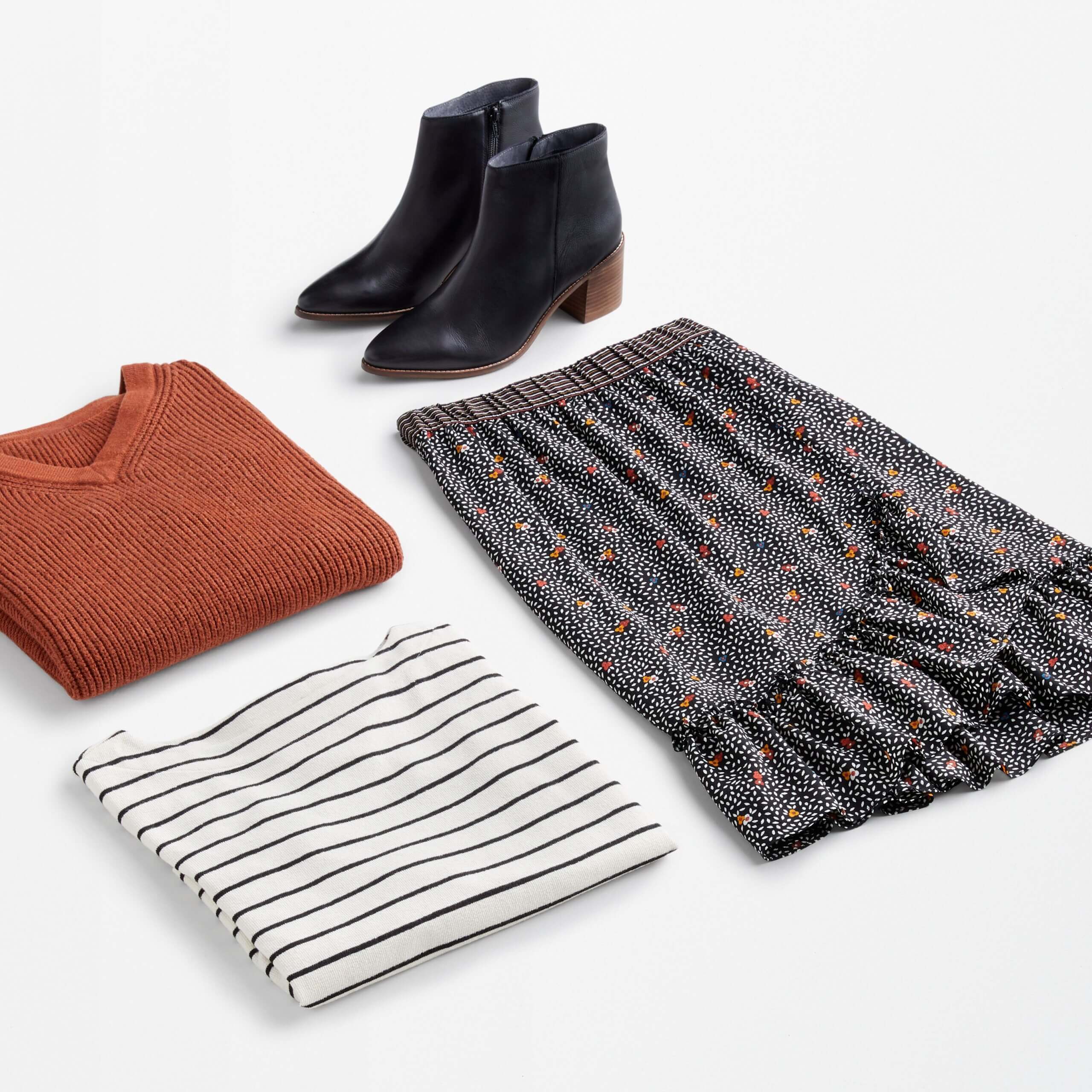 Stitch Fix women’s date night at home featuring floral midi skirt, striped tee, red v-neck sweater and black ankle boots.