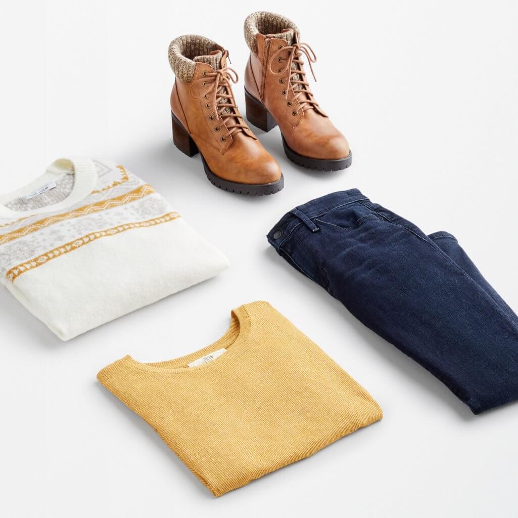 Stitch Fix women’s apple-picking outfit with blue skinny-fit corduroys, yellow crew neck T-shirt, white Fair Isle sweater and brown lace-up fleece-lined boots.