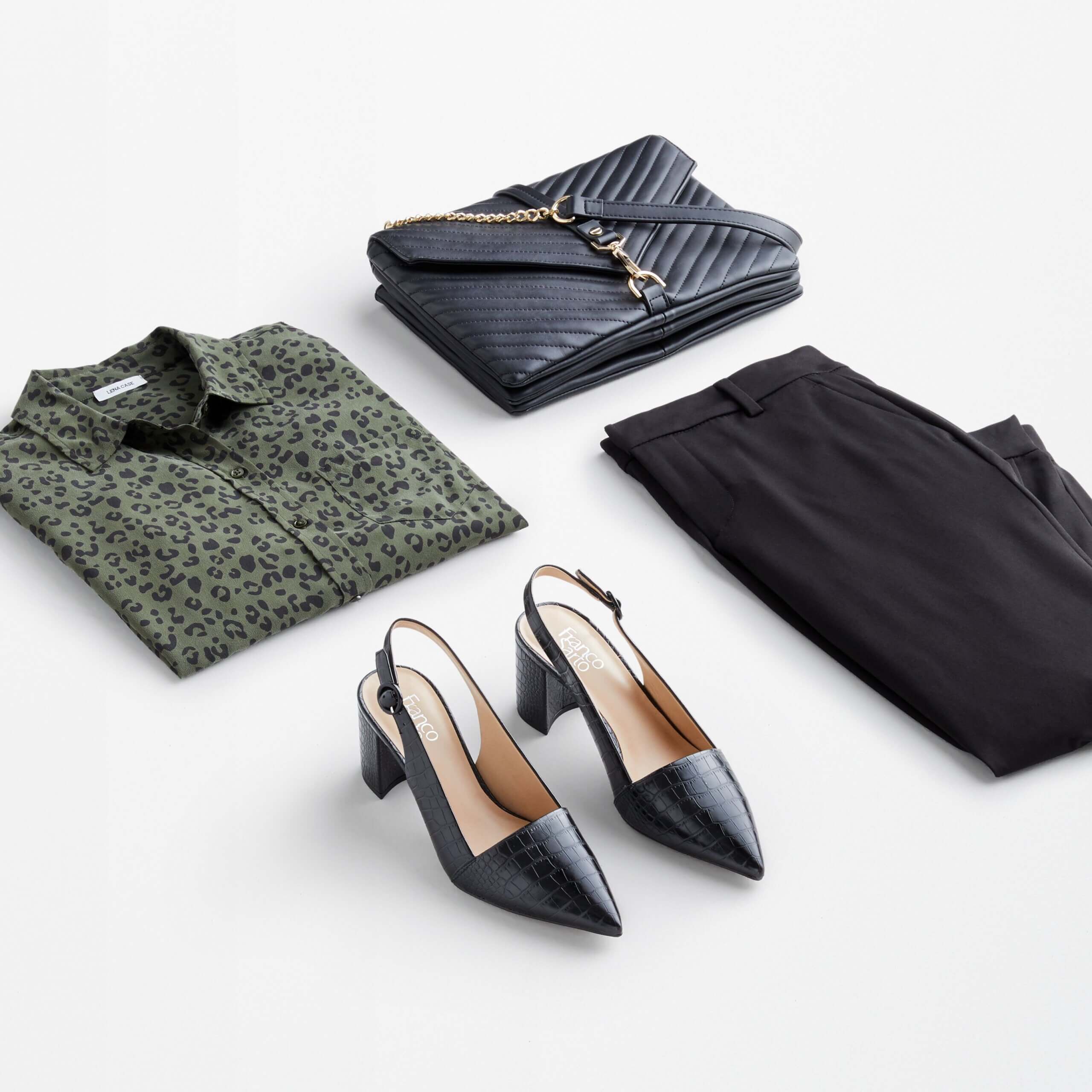 Stitch Fix women’s outfit featuring green animal print button-front blouse, black pants, black heels and navy blue quilted purse.