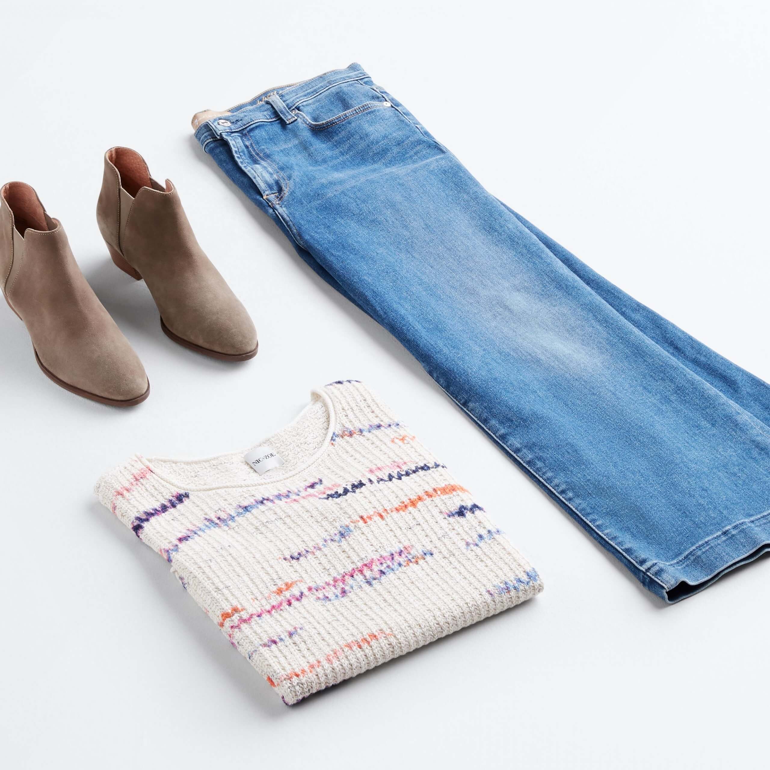 Stitch Fix outfit laydown featuring brown booties, off-white sweater and straight-leg, light-wash jeans.