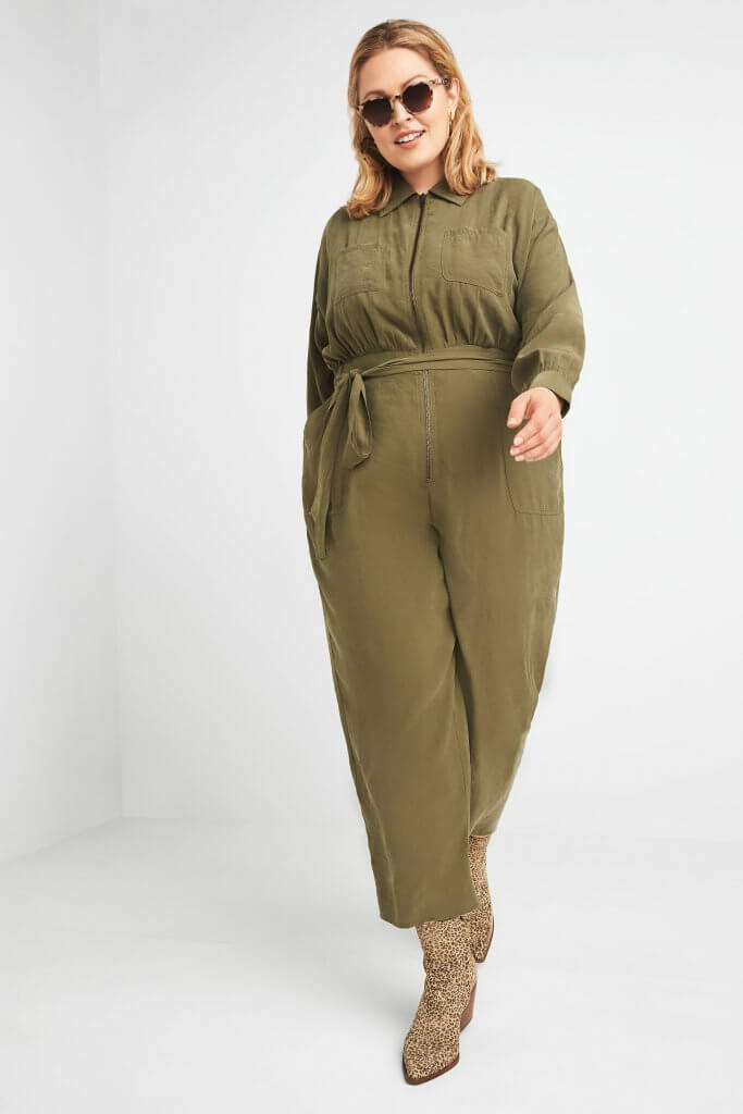 Stitch Fix model wearing sunglasses, olive jumpsuit and leopard-print booties.