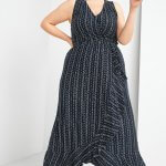 Stitch Fix women’s model wearing boho style navy blue printed maxi- dress with brown slide sandals.