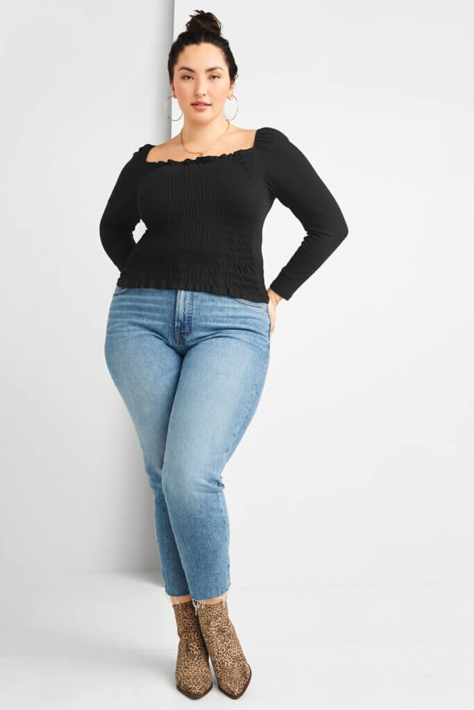 Stitch Fix women’s model in boots with jeans outfit featuring black long-sleeve square-neck top, light-wash skinny jeans and leopard-print ankle boots.
