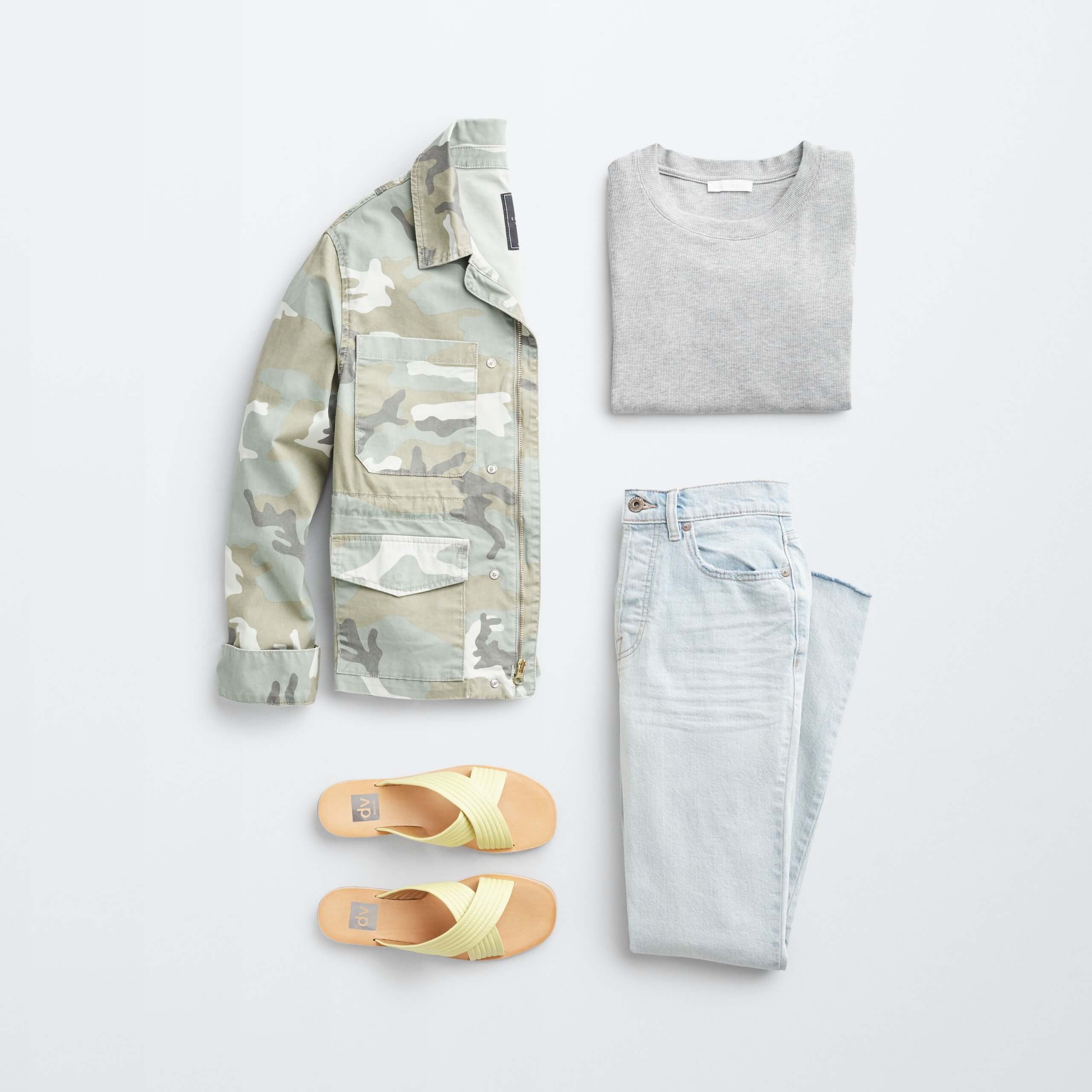Stitch Fix women’s outfit laydown featuring green camo utility jacket, grey pullover, light wash jeans and yellow slide sandals. 