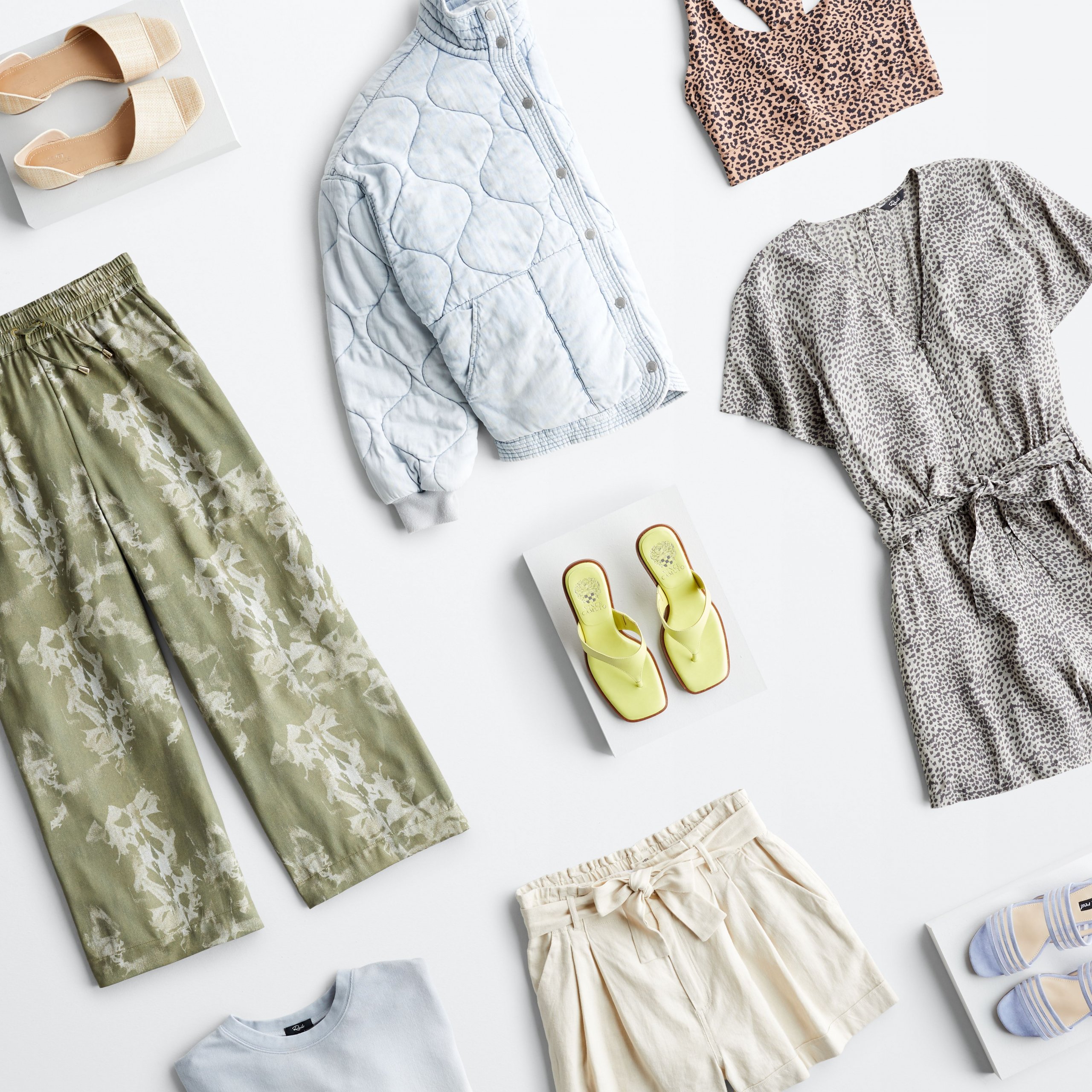 Stitch Fix eco-friendly clothing laydown featuring wide-leg pants, romper, tops, denim quilted jacket, shorts and sandals.