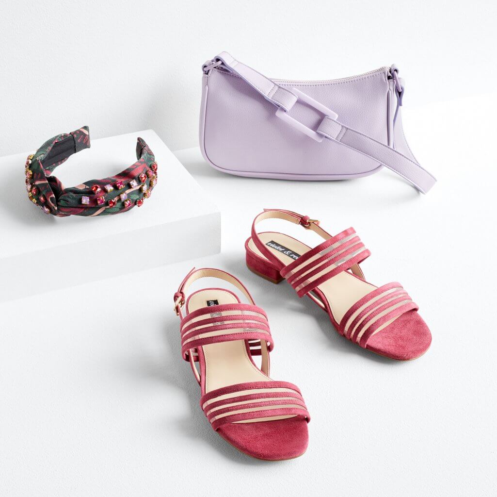 Stitch Fix women’s jeweled headband, lavender purse and dark pink heels.