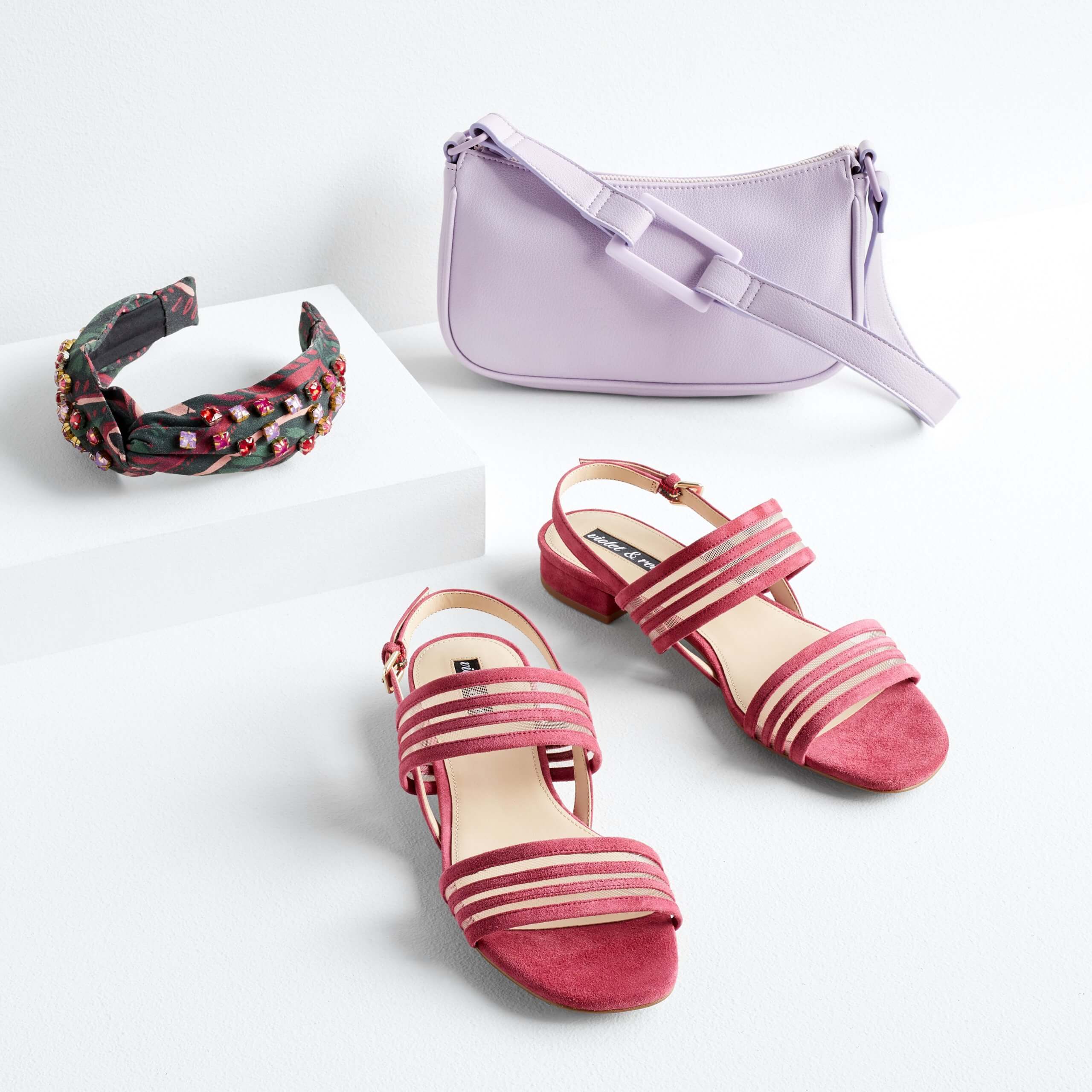 Stitch Fix women’s jeweled headband, lavender purse and dark pink heels.