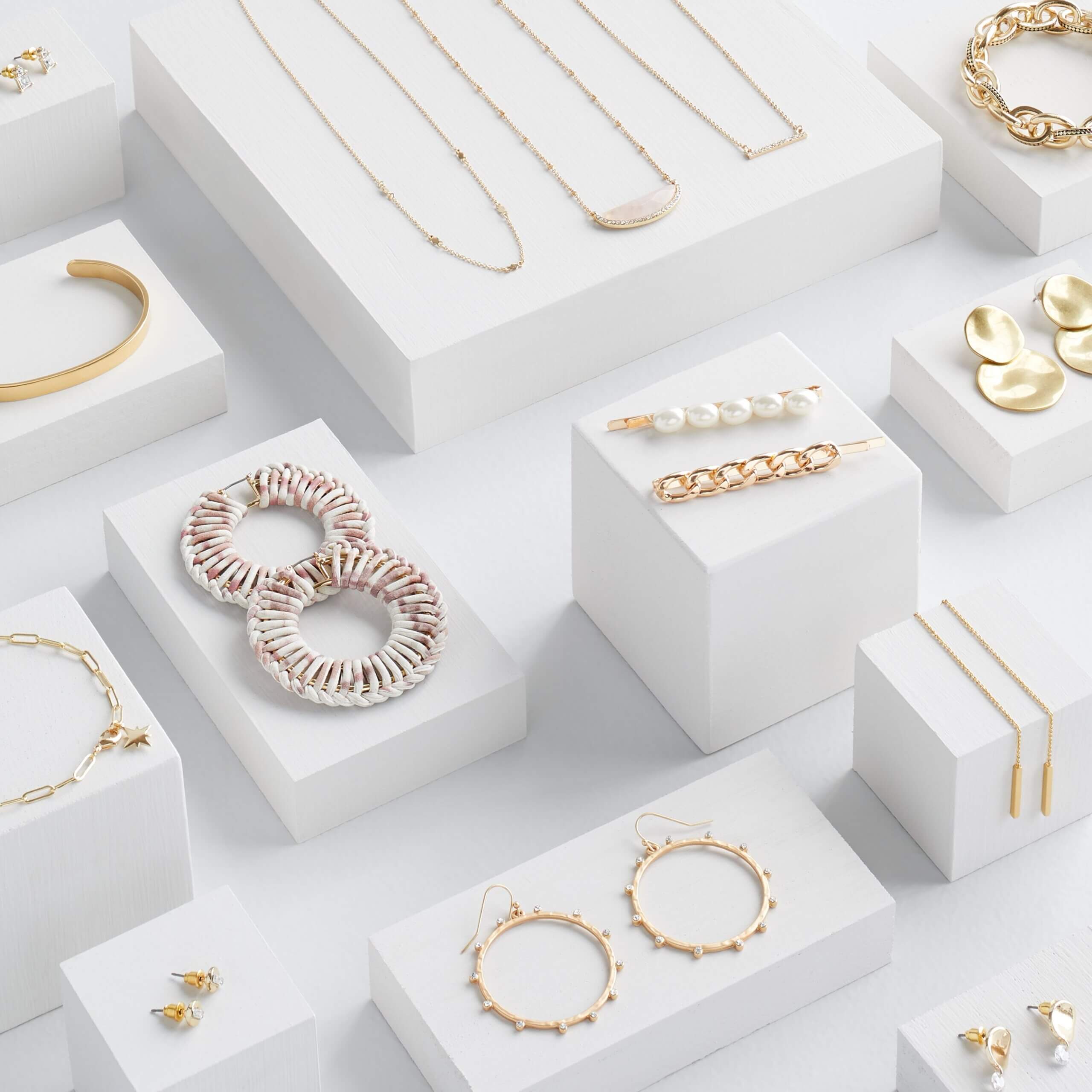 Stitch Fix women’s gold and pearl earrings, chain and bangle bracelets, pearl hair clips and necklaces.