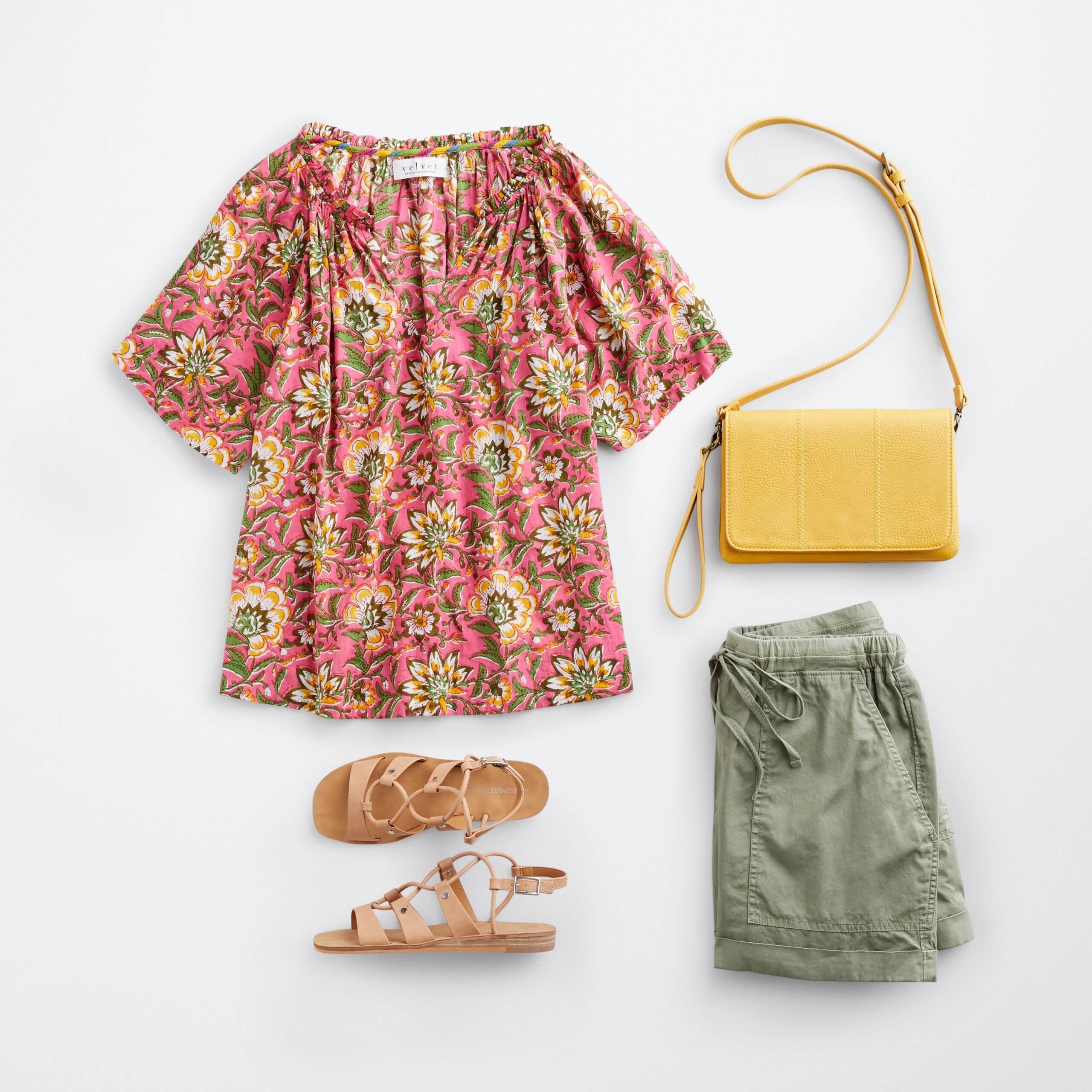 Stitch Fix women’s boho outfit featuring red floral print top with yellow crossbody bag, olive green drawstring shorts and brown strappy sandals.