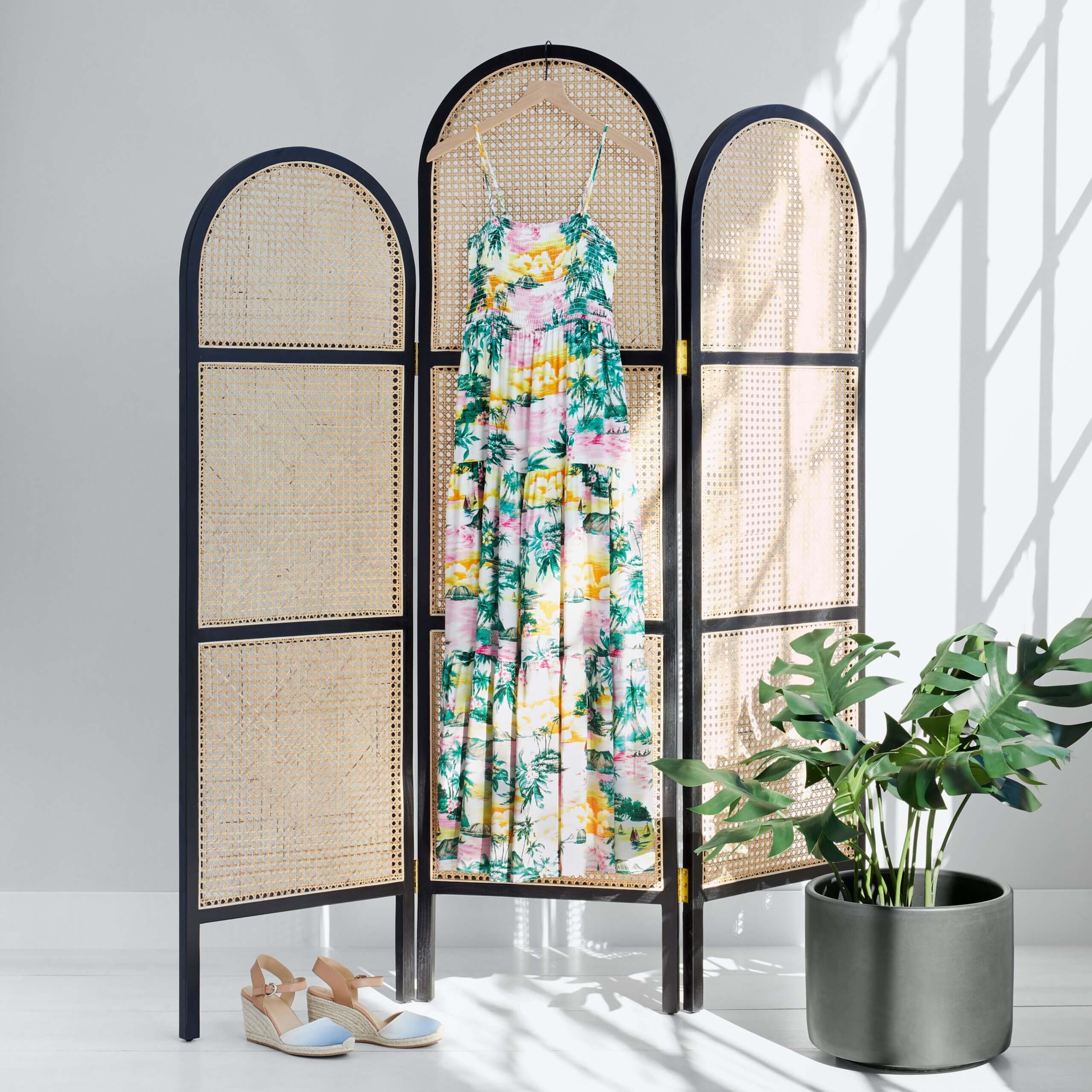 Stitch Fix women’s resort wear maxi dress hanging next to blue and beige espadrille wedges and potted plant.