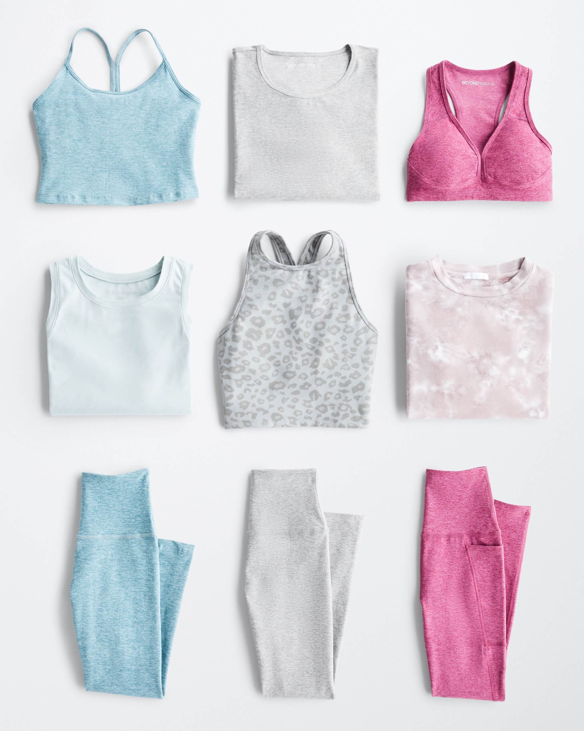Stitch Fix Women's outfit laydown featuring sports bras, athletic tops and leggings in shades of blue, light grey and pink. 