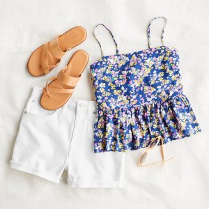  Stitch Fix women’s outfit laydown featuring tan sandals, a floral tank top, yellow sunglasses and white shorts.
