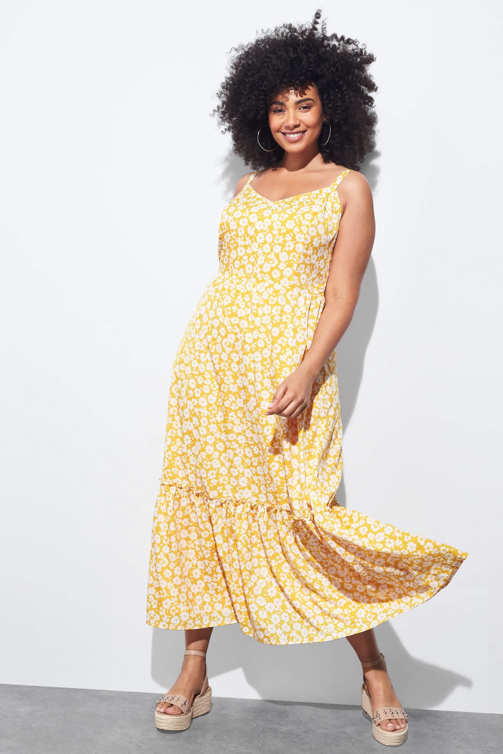 Stitch Fix Women's model wearing yellow maxi dress.