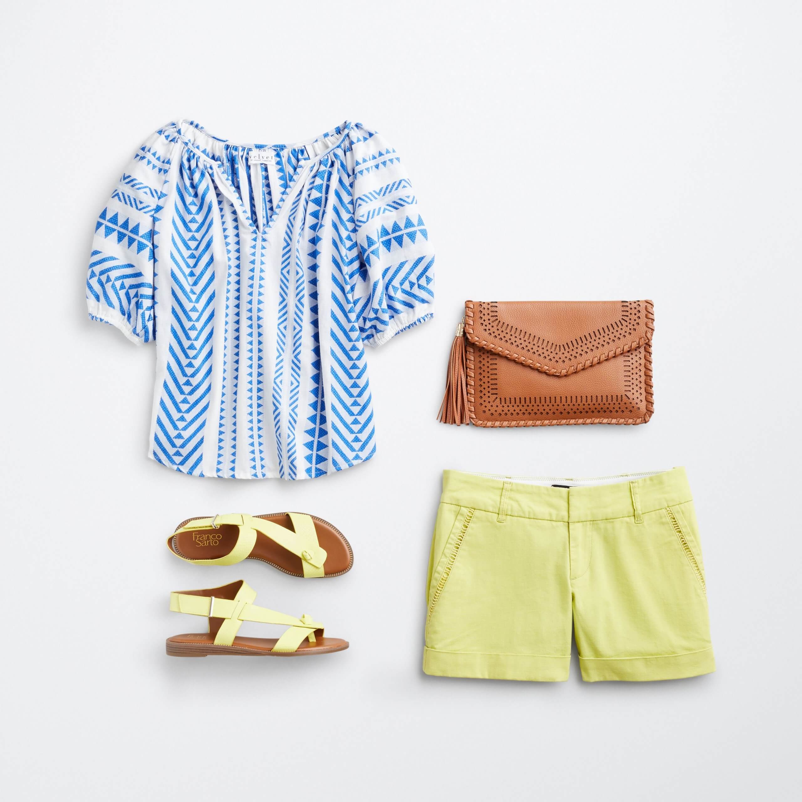 Stitch Fix Women's outfit laydown featuring blue and white printed shirt, brown clutch, yellow strappy sandals and yellow shorts. 