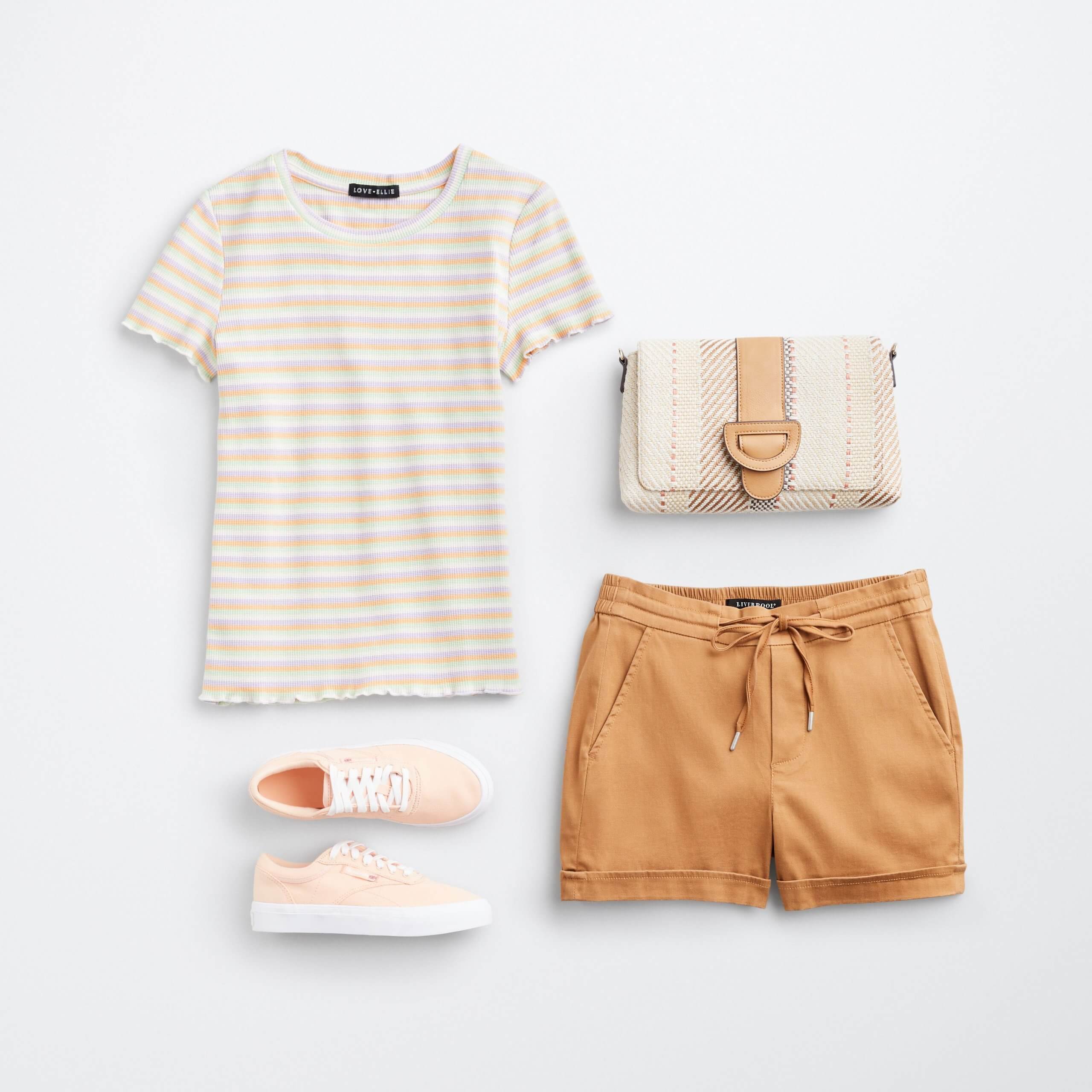 Stitch Fix women’s eco-friendly outfit laydown featuring striped T-shirt, orange shorts, pale orange sneakers and woven bag.