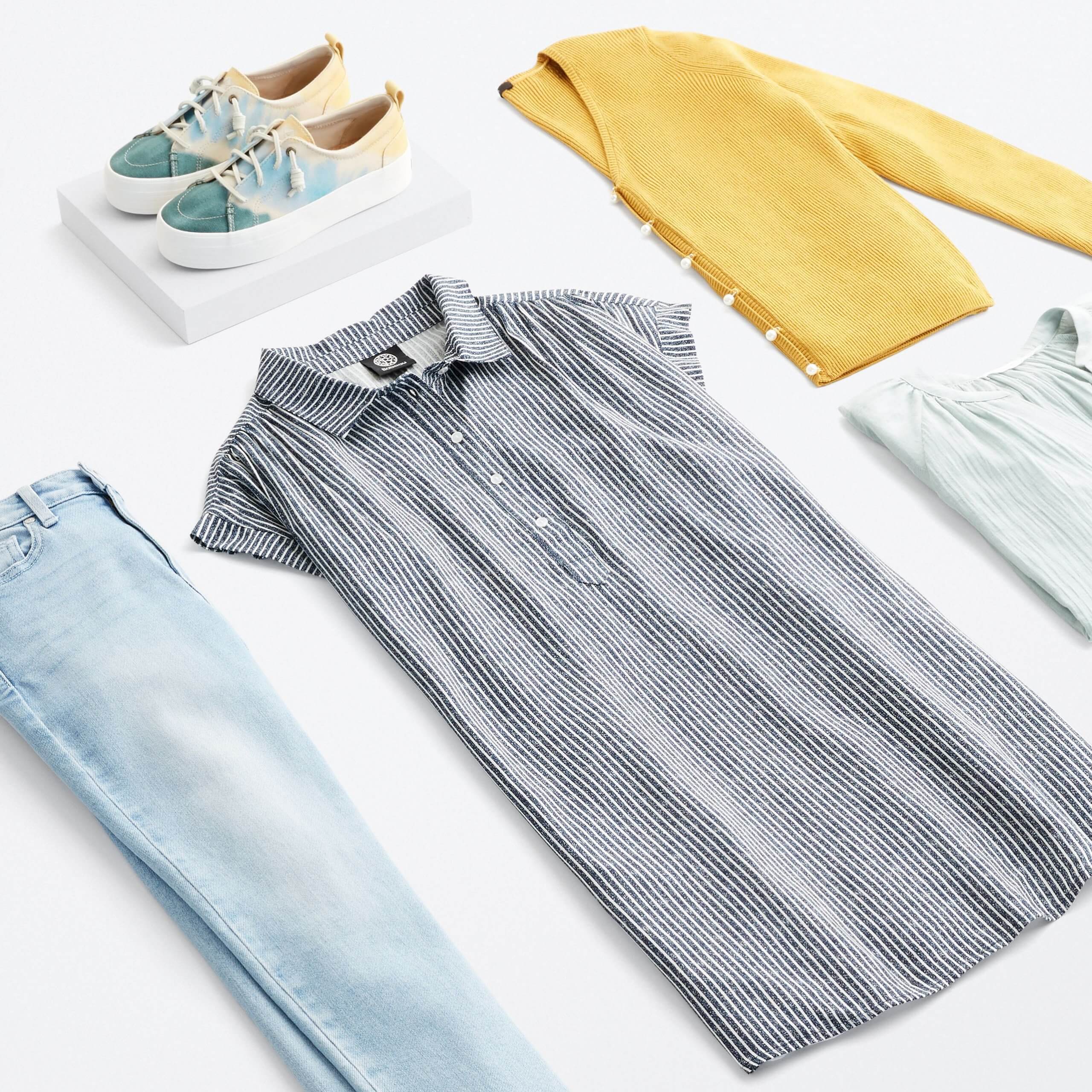 Stitch Fix Women's outfit laydown featuring grey striped collared dress, yellow cardigan, mint ruffle top, light wash jeans and green, blue and yellow tie-dye sneakers. 