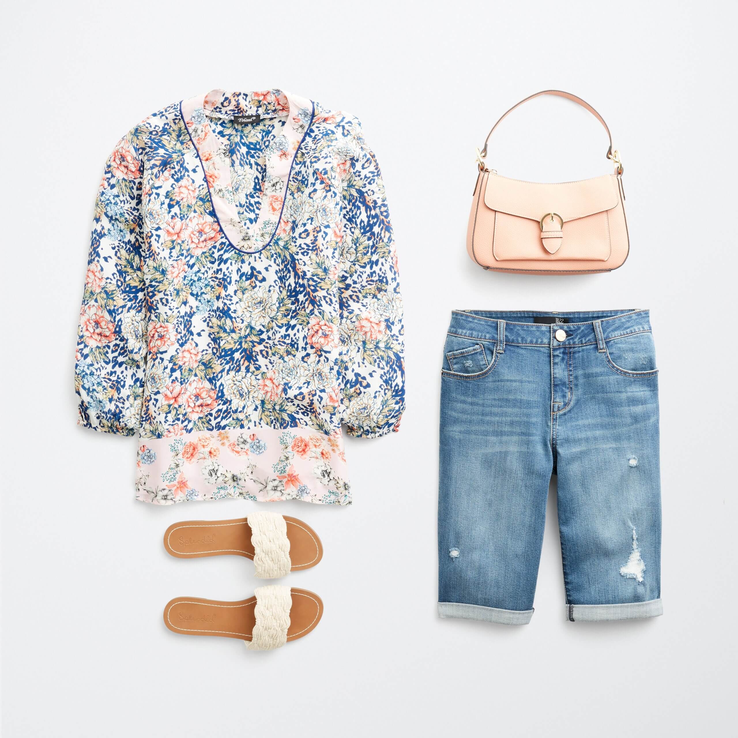 Stitch Fix Women's outfit laydown featuring blue, pink and cream printed blouse with blue denim bermuda shorts, pink purse and white slide sandals. 