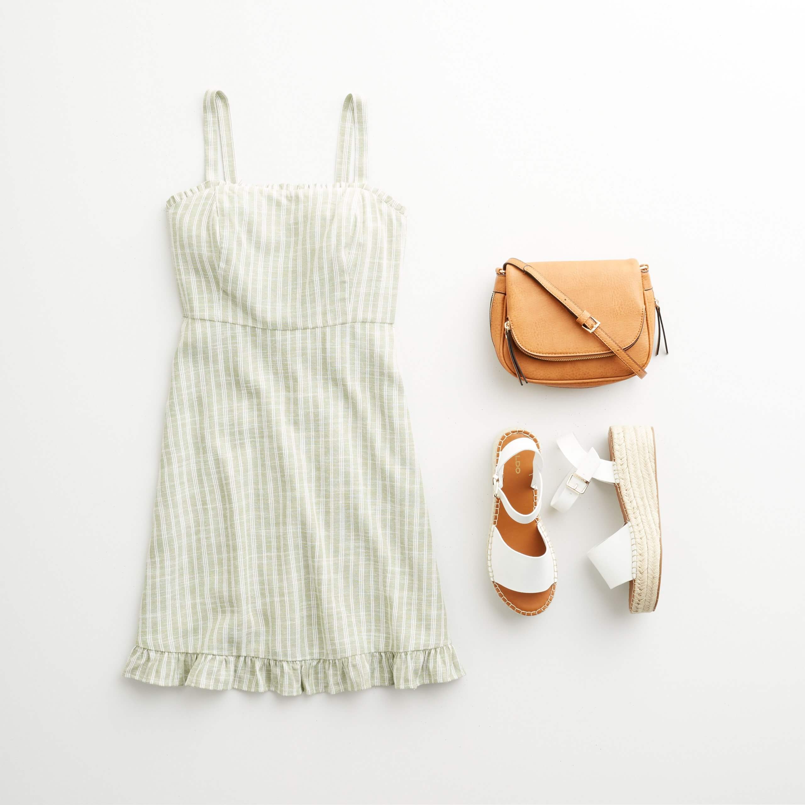 Stitch Fix Women's outfit laydown featuring green and white striped sundress, tan crossbody bag and white wedges. 