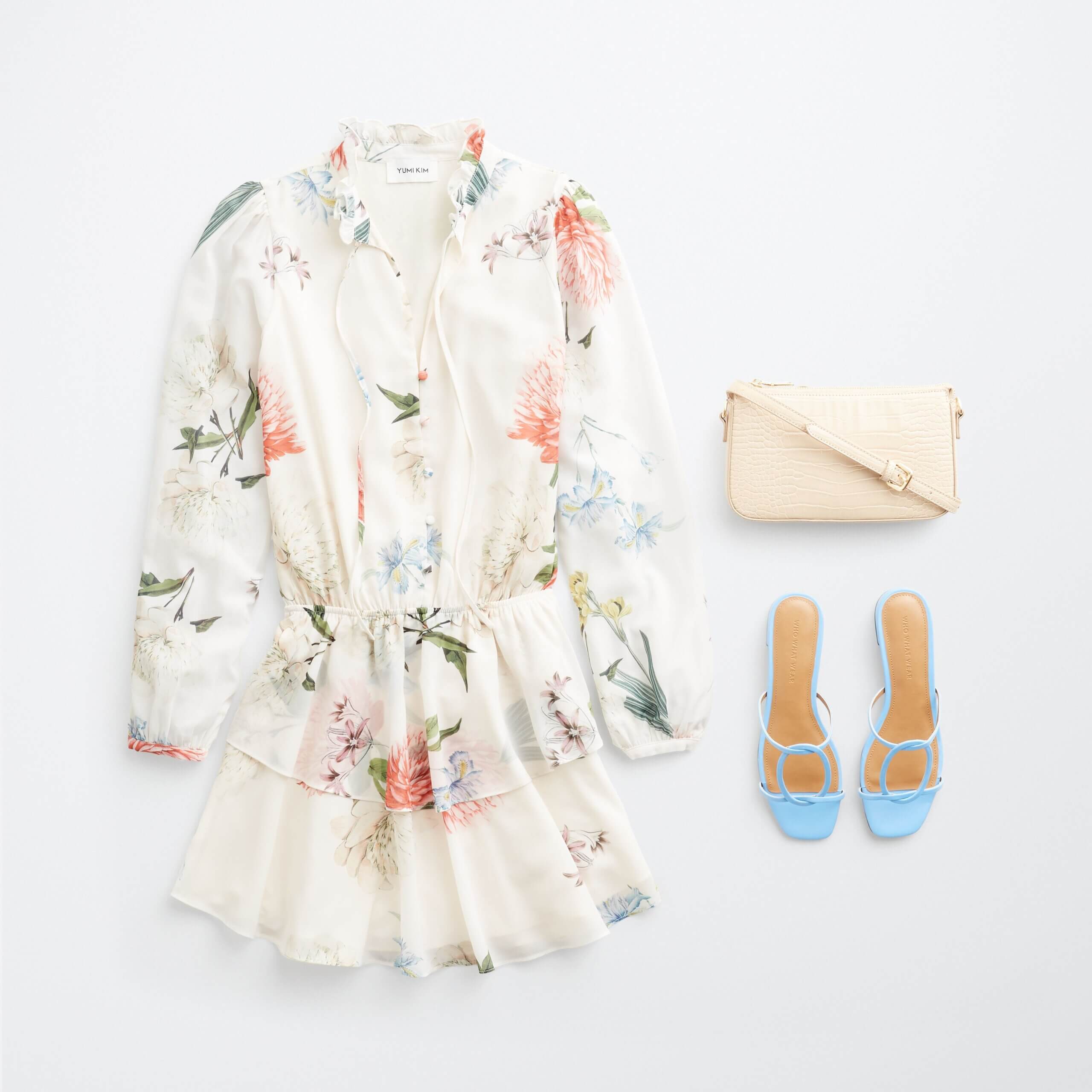 Stitch Fix women's outfit laydown featuring white floral romper, blue slide heeled sandals and cream crossbody bag.