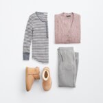 Stitch Fix women's cabincore outfit featuring gray and white stripe long sleeve henley, pink button-down cardigan, gray jogger pants, and tan sherpa boots.