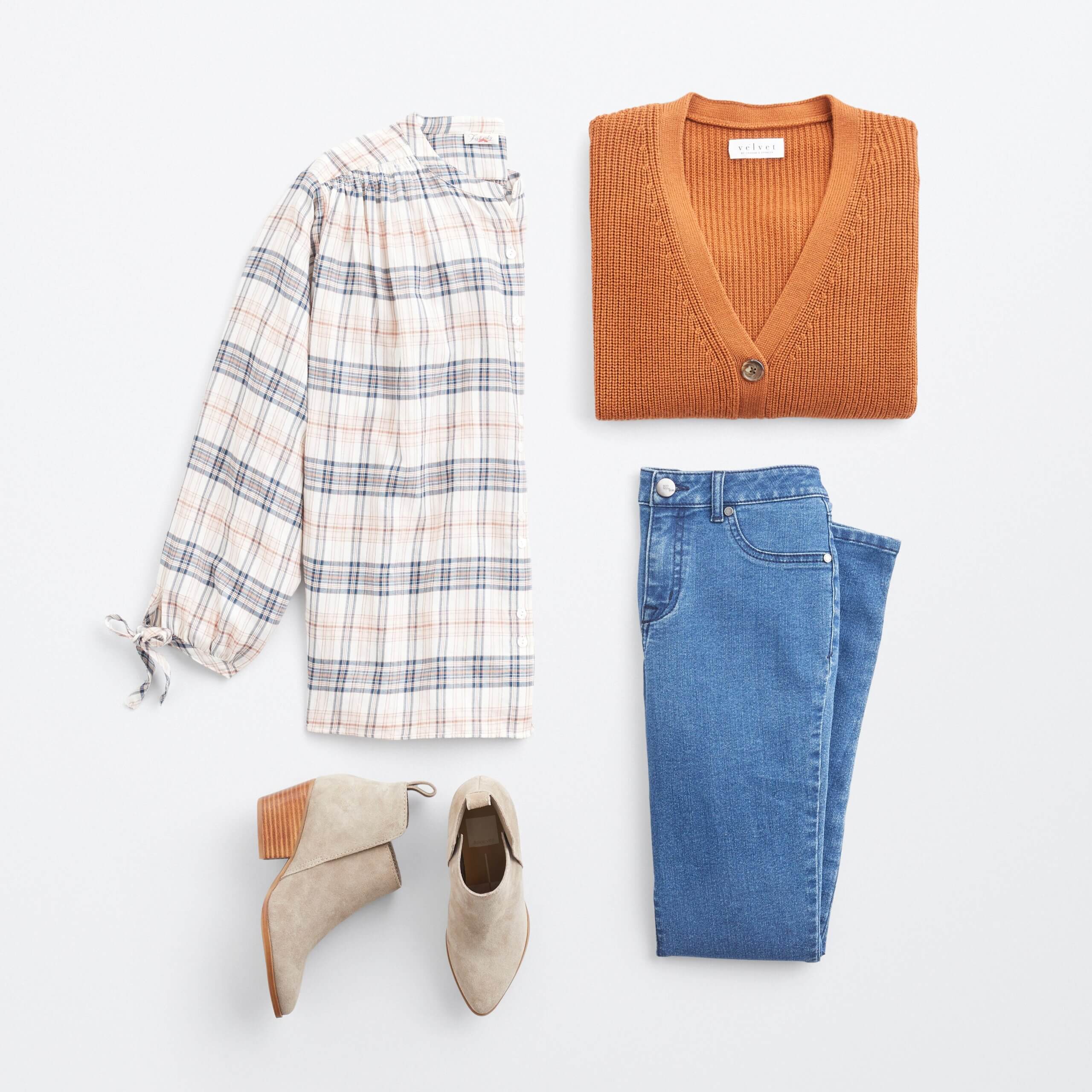 Stitch Fix women's cabincore outfit featuring white, navy and tan plaid blouse, brown button-down cardigan, blue jeans and tan booties.