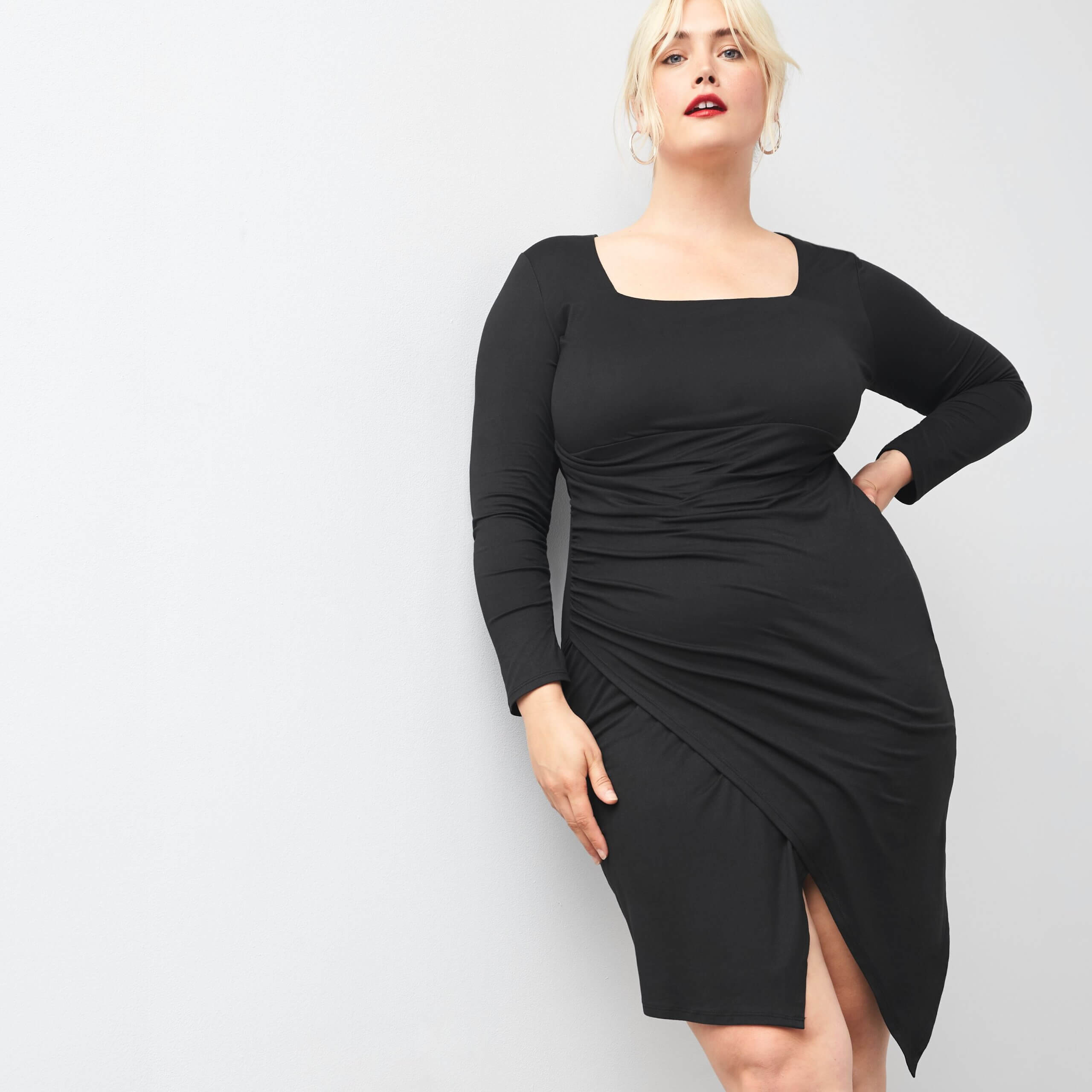 Stitch Fix women’s model wearing homemade Halloween costume with black dress and red lip.