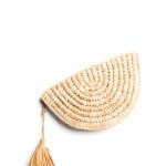 Stitch Fix women’s brown woven clutch with pom zipper pull.