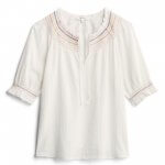 Stitch Fix women’s white short-sleeve shirt with colorful embroidered neckline.