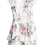 Stitch Fix Summer Cocktail Attire white floral a-line, v-neck dress with ruffle skirt and tie waist.