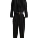 Stitch Fix women’s black jumpsuit with long sleeves and black belt with gold buckle.