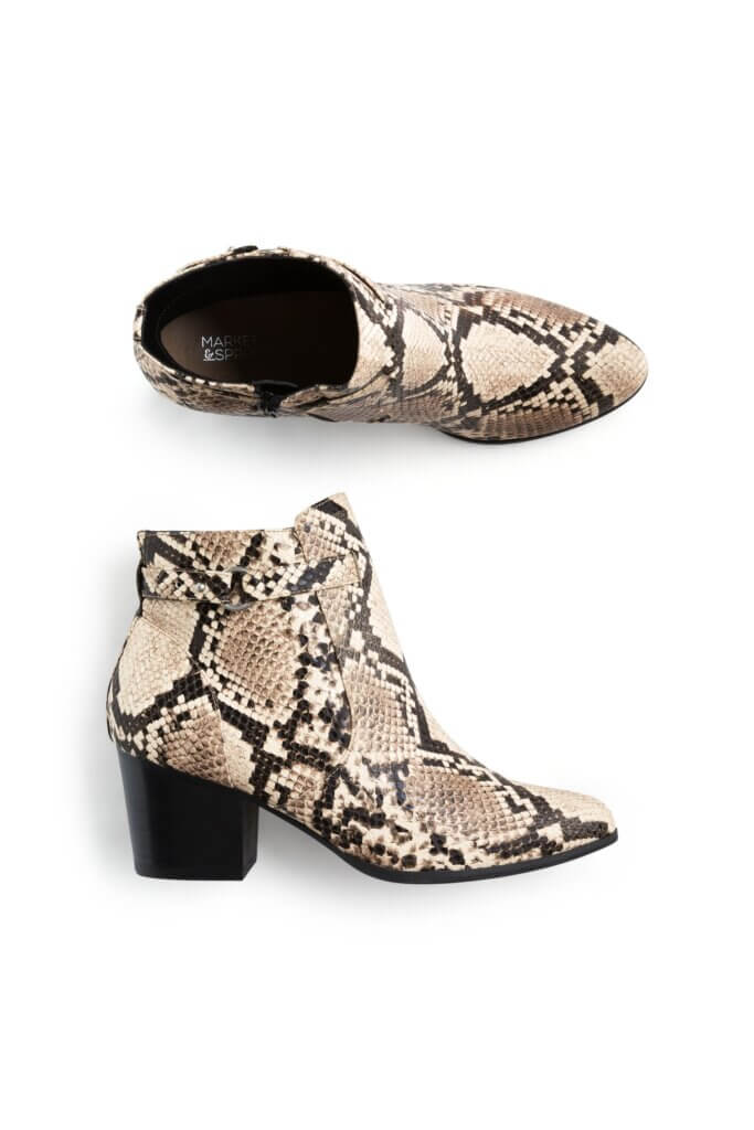 Stitch Fix Women’s Collection featuring black and cream snakeskin print leather ankle boots.