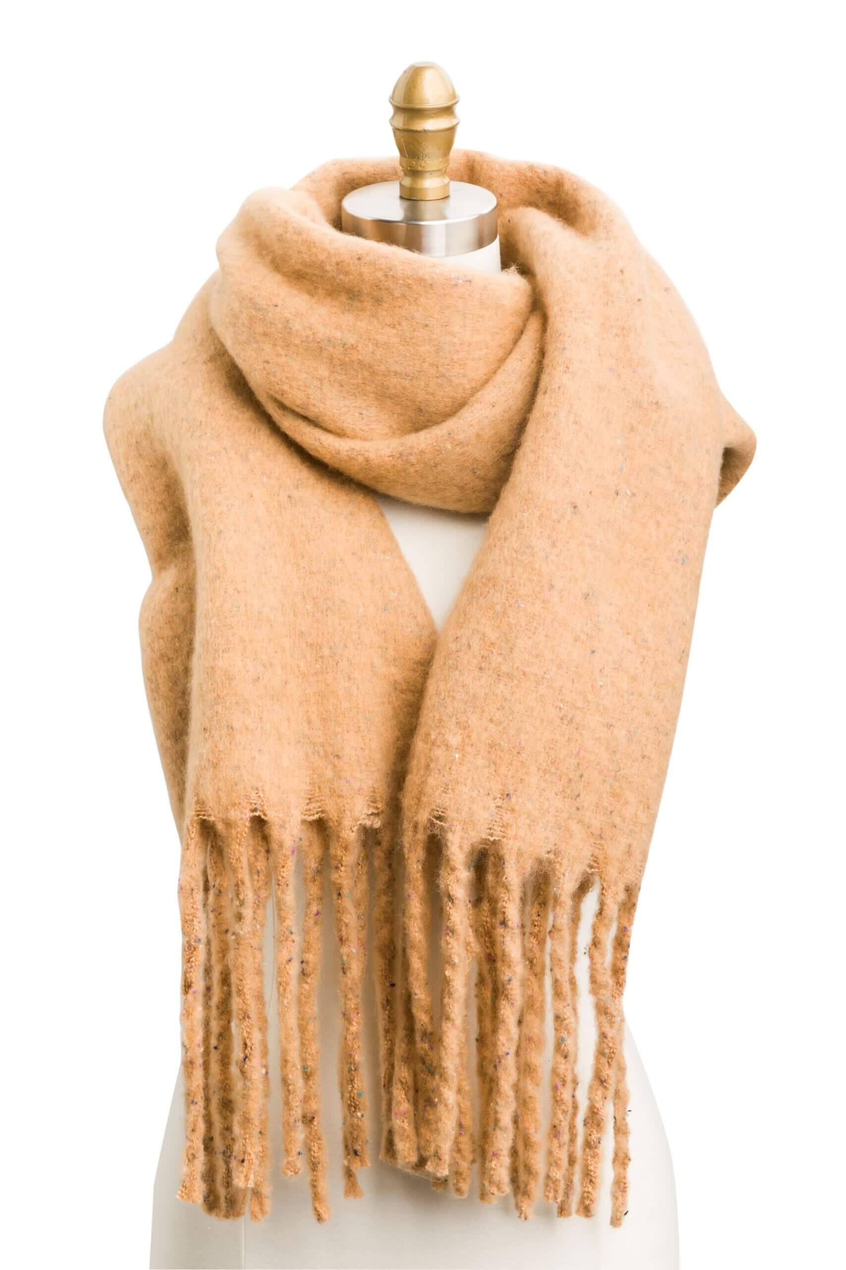 Stitch Fix women’s camel blanket scarf with felted fringe ends on bust form.