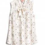 Stitch Fix women’s sleeveless blouse in off-white floral polka-dot print with bow-neck detail.