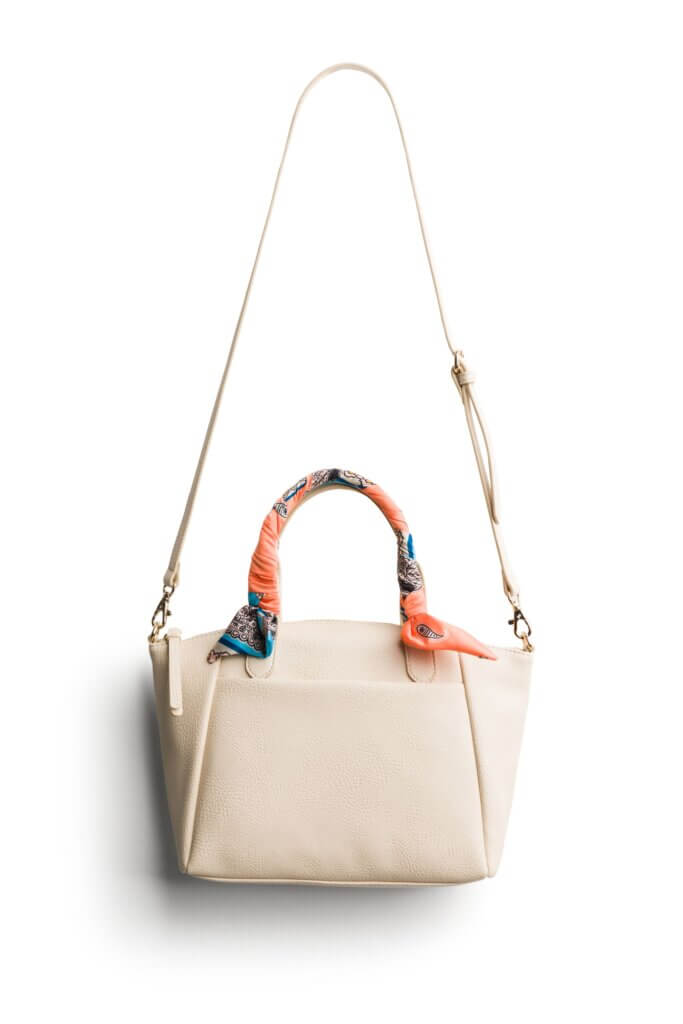 Stitch Fix women's white purse with scarf-wrapped handles.