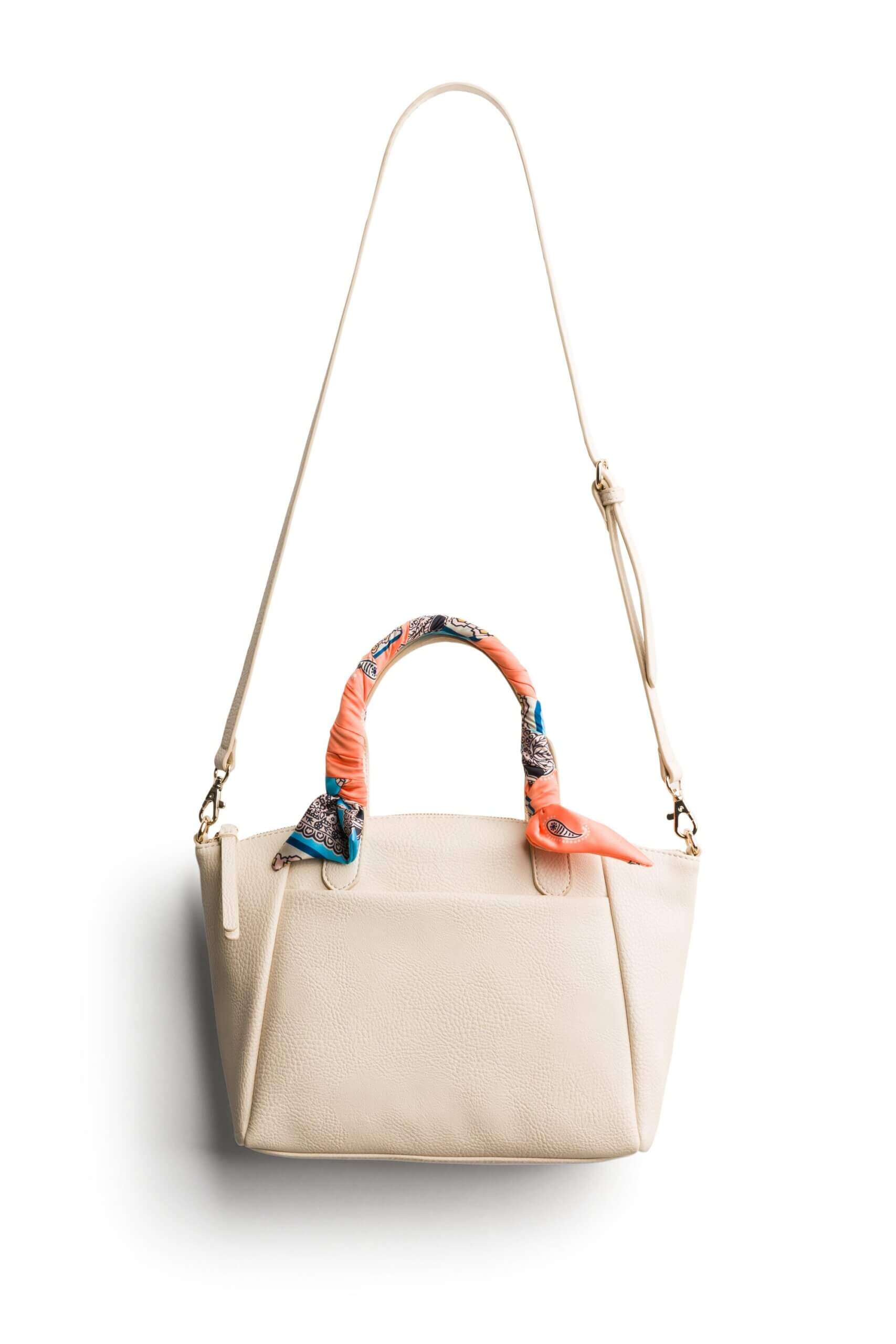 Stitch Fix women's white purse with scarf-wrapped handles.