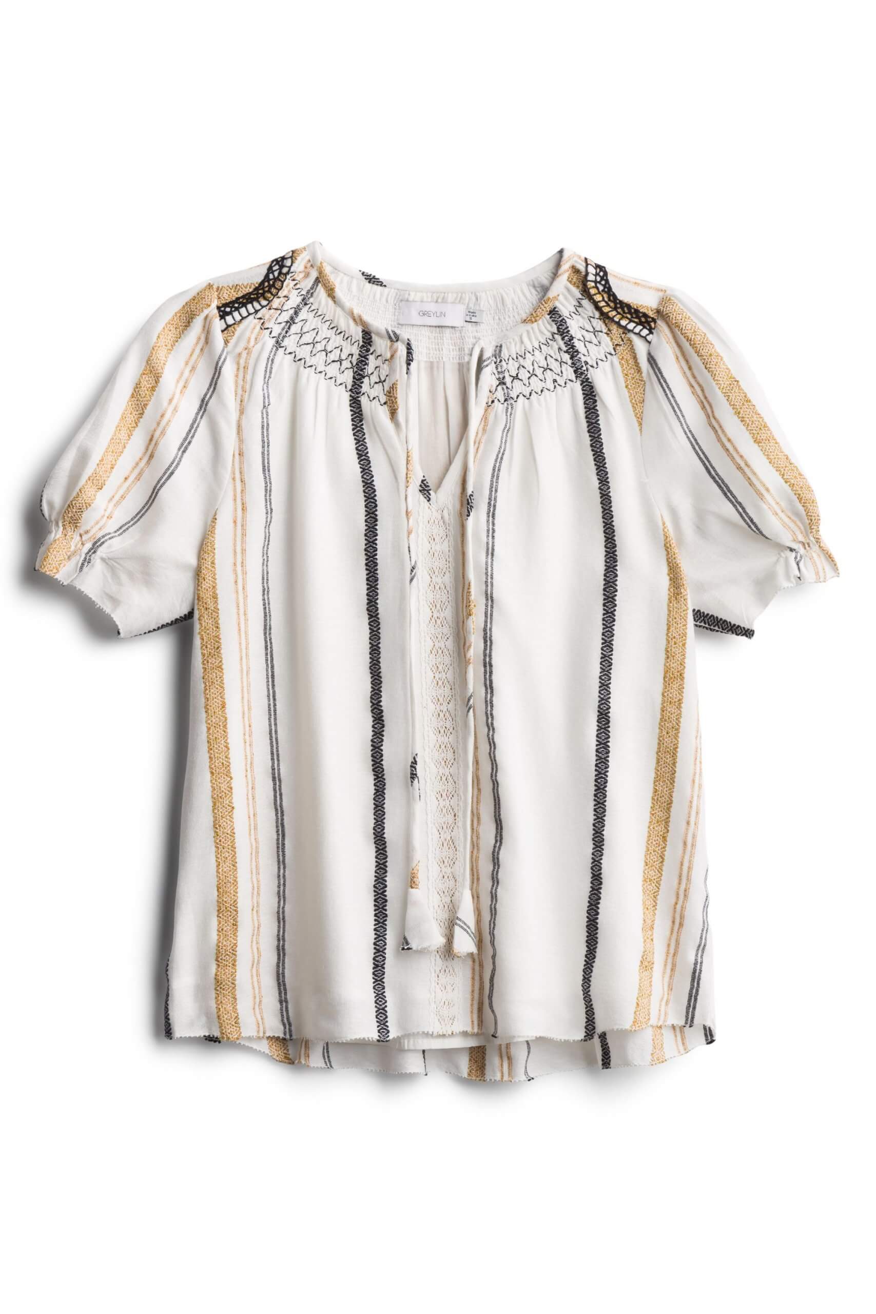Stitch Fix Women’s white blouse with vertical yellow and grey stripes and tassel detail.