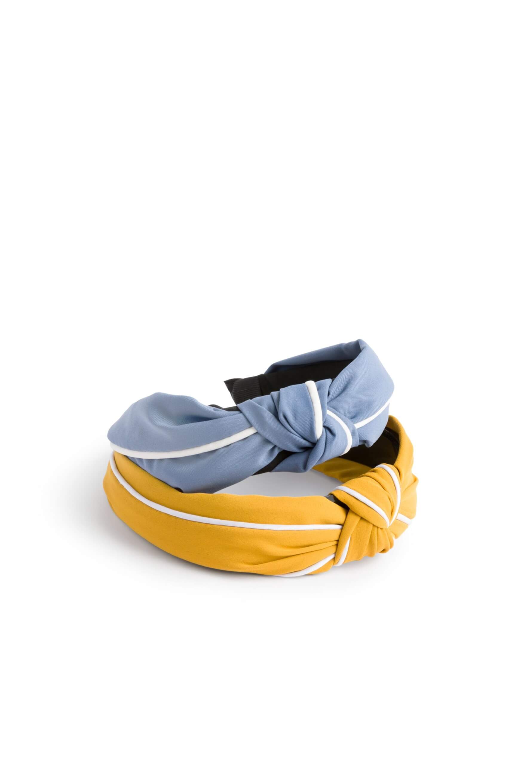 Stitch Fix Women’s Hair Accessories featuring light blue and yellow headbands with white piping trim detail.