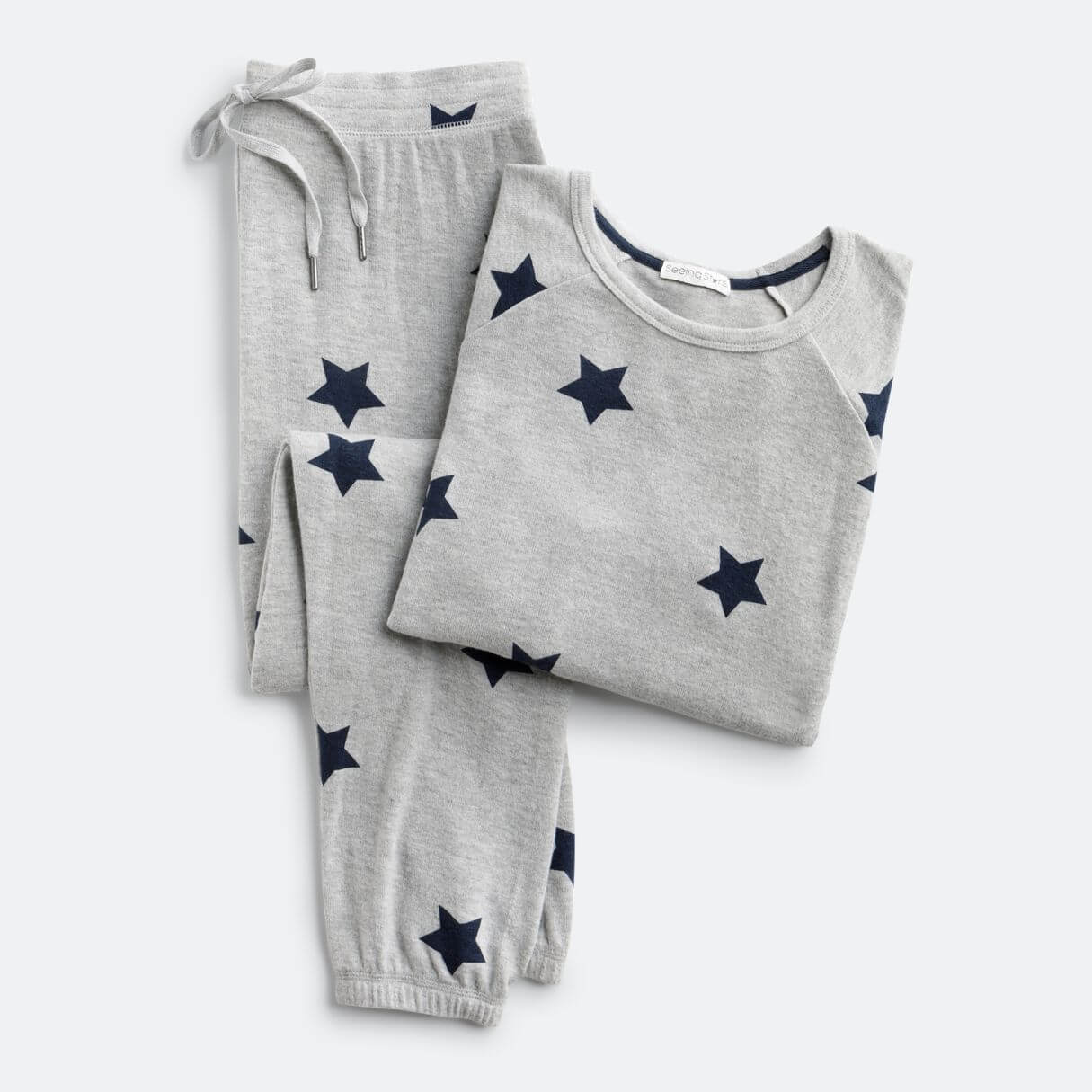 Stitch Fix women's outfit laydown featuring jogger and sweatshirt lounge set in gray with navy blue star print.