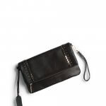 Stitch Fix Women’s black clutch purse with gold hardware and wristlet strap.