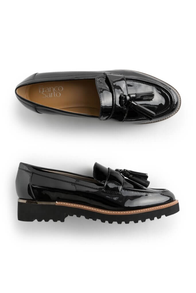 Stitch Fix women’s black lug sole loafers with tassels.